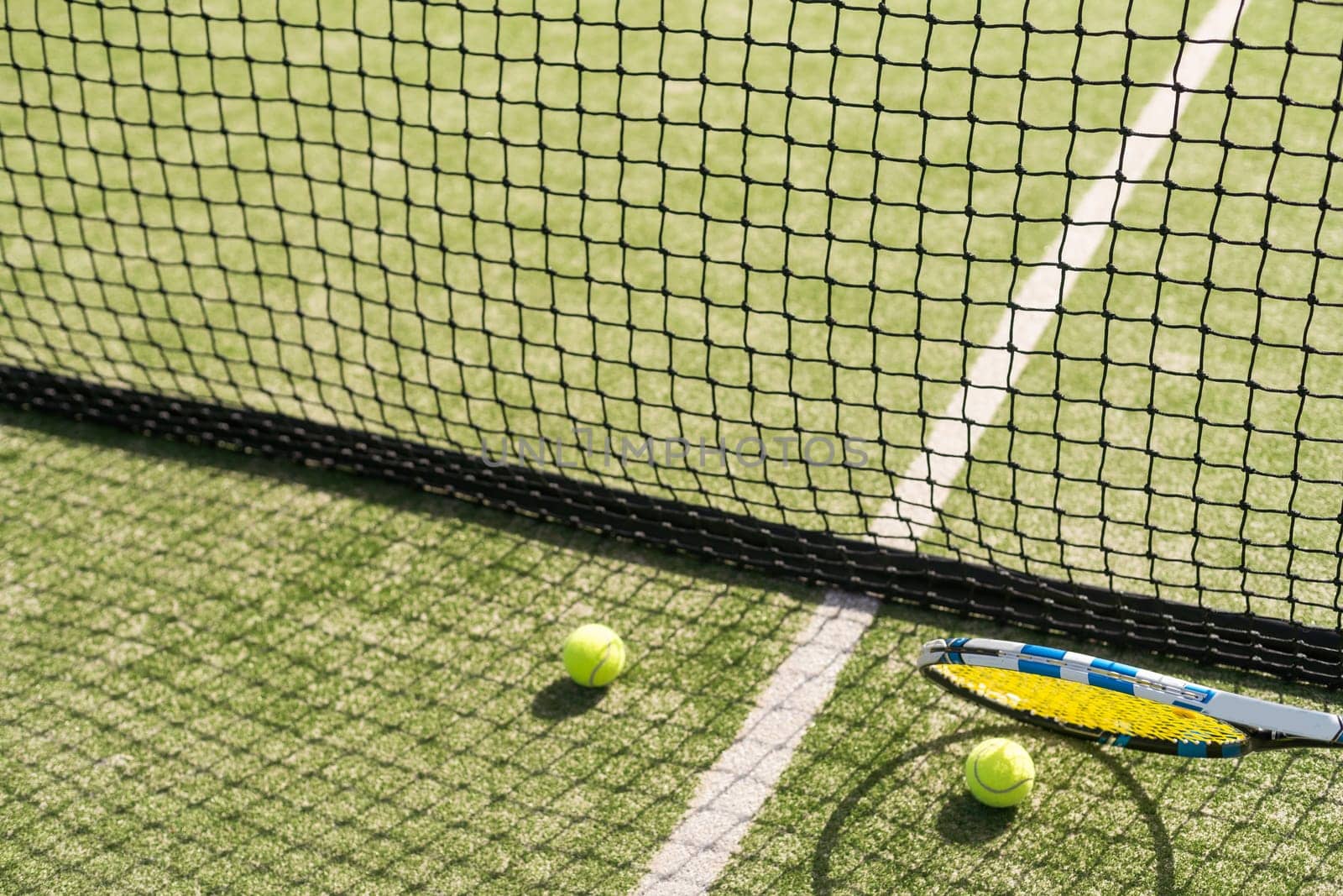 Tennis net on a green field. High quality photo