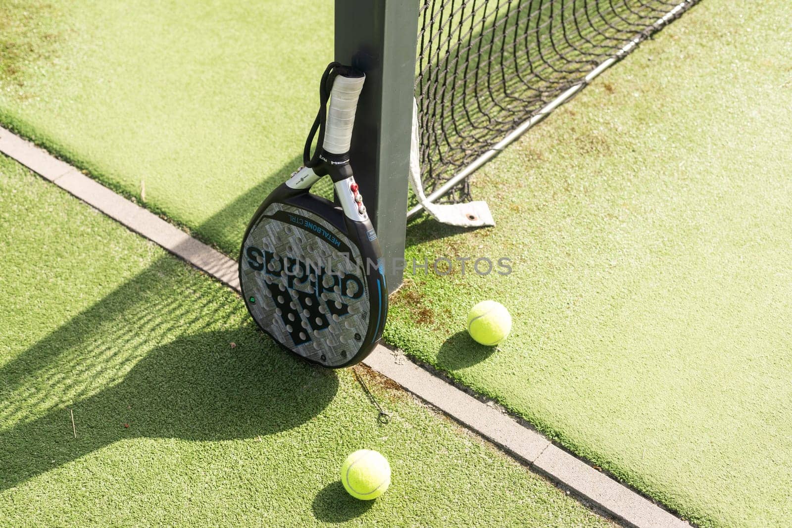 Ukraine Kyiv, April 02 2024. Paddle tennis racket and ball. High quality photo