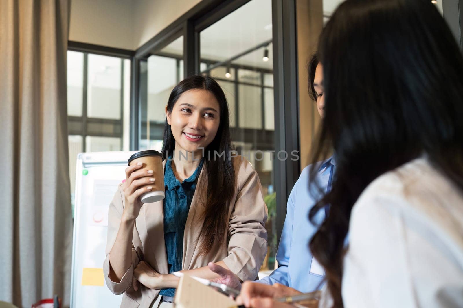 Business woman talking and brainstorming, discussion with colleague about strategy by itchaznong