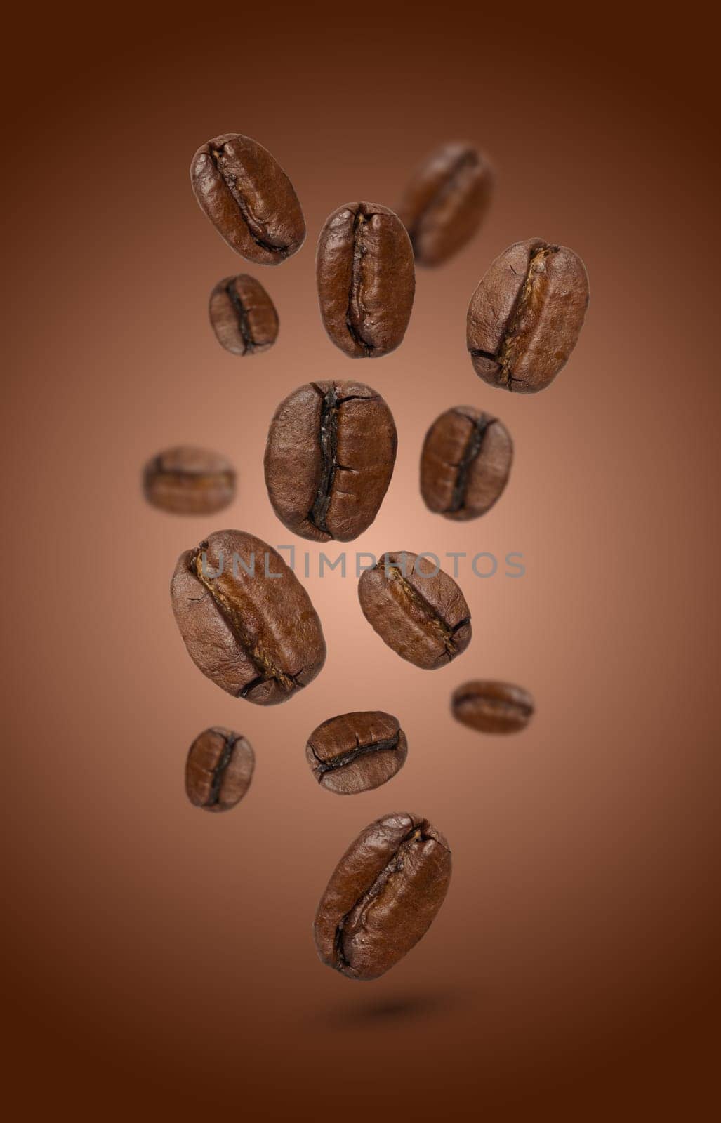 Levitating coffee beans on a brown background