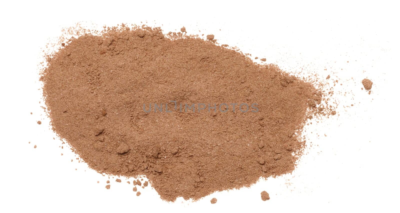 Dry ground cocoa powder scattered on an isolated background by ndanko