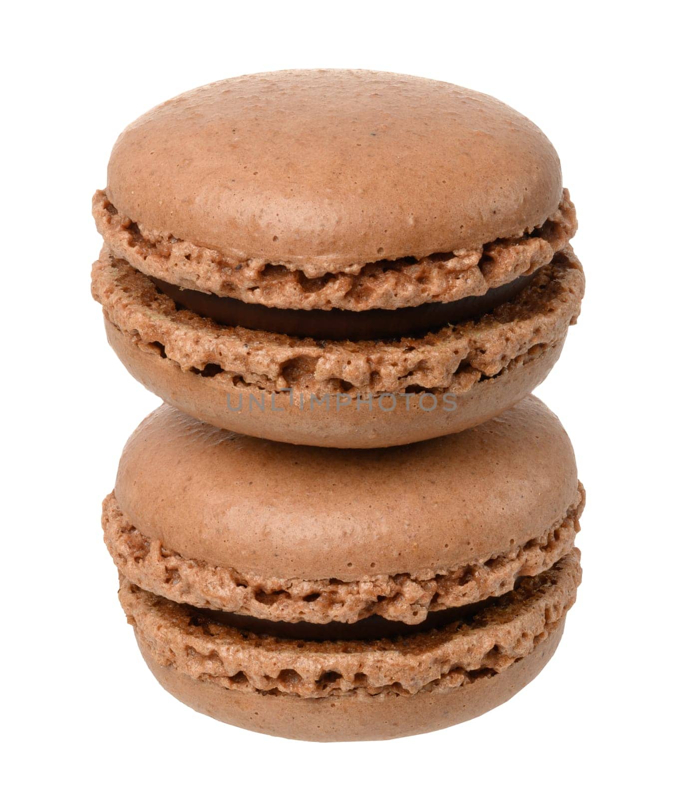 Stack of chocolate macarons on isolated background, close up