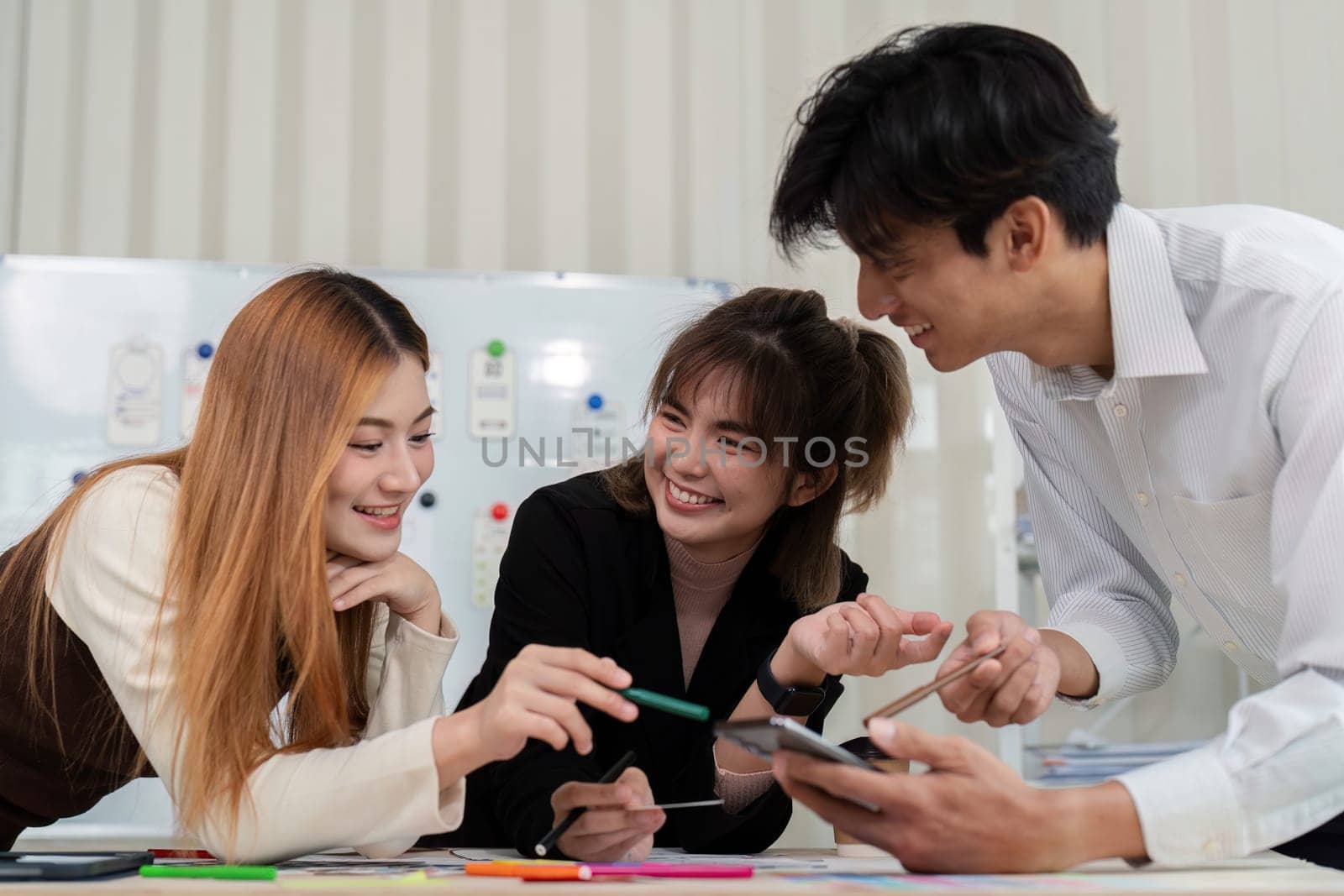 Team of creative ux developer and ui designer brainstorm about app interface design at modern office. Creative digital development.