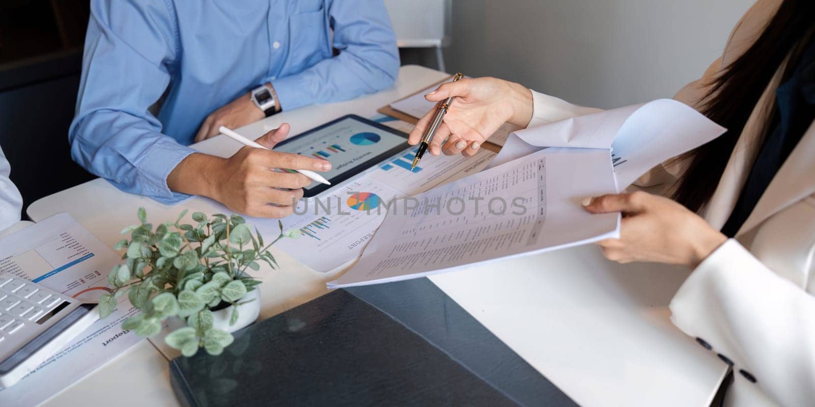 Business team talking planning analyze investment and marketing on tablet, collaboration discussing working analyzing with financial data and marketing business strategy project in office.