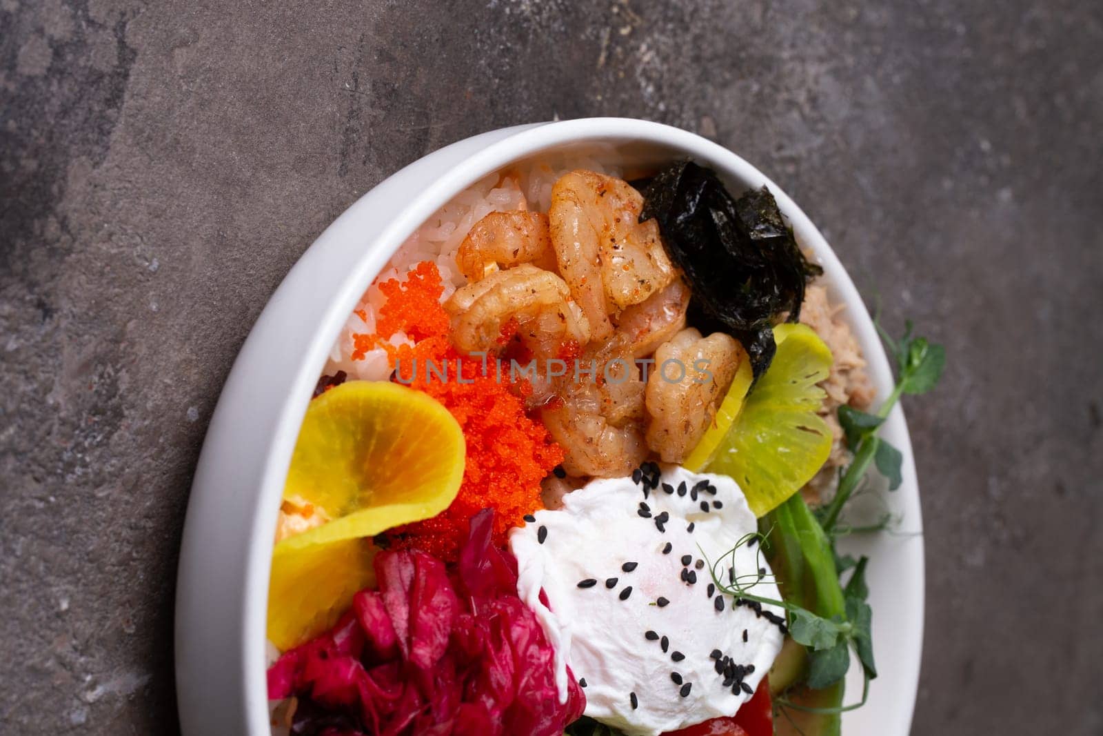 Fresh seafood and colorful vegetables served in a white bowl, a delicious and nutritious meal option for food enthusiasts.