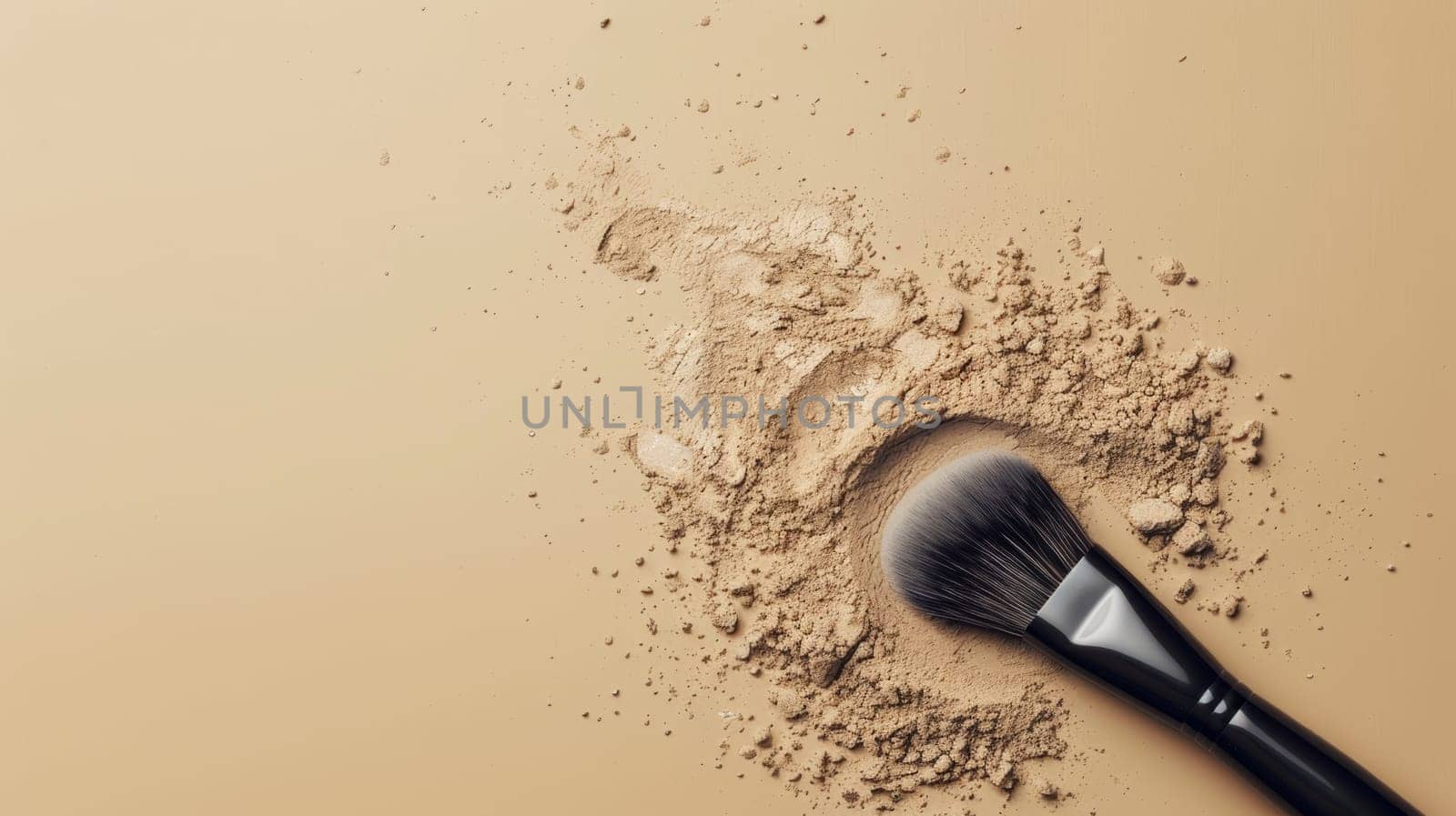 Close up of a makeup brush and powder explosion on a beige background.