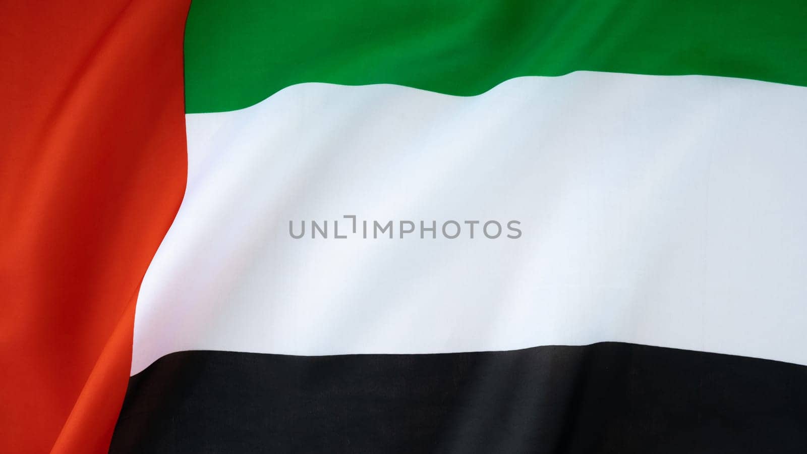 National symbol of UAE. United Arab Emirates flag background. Copy space for your text. Concept of National day Independence