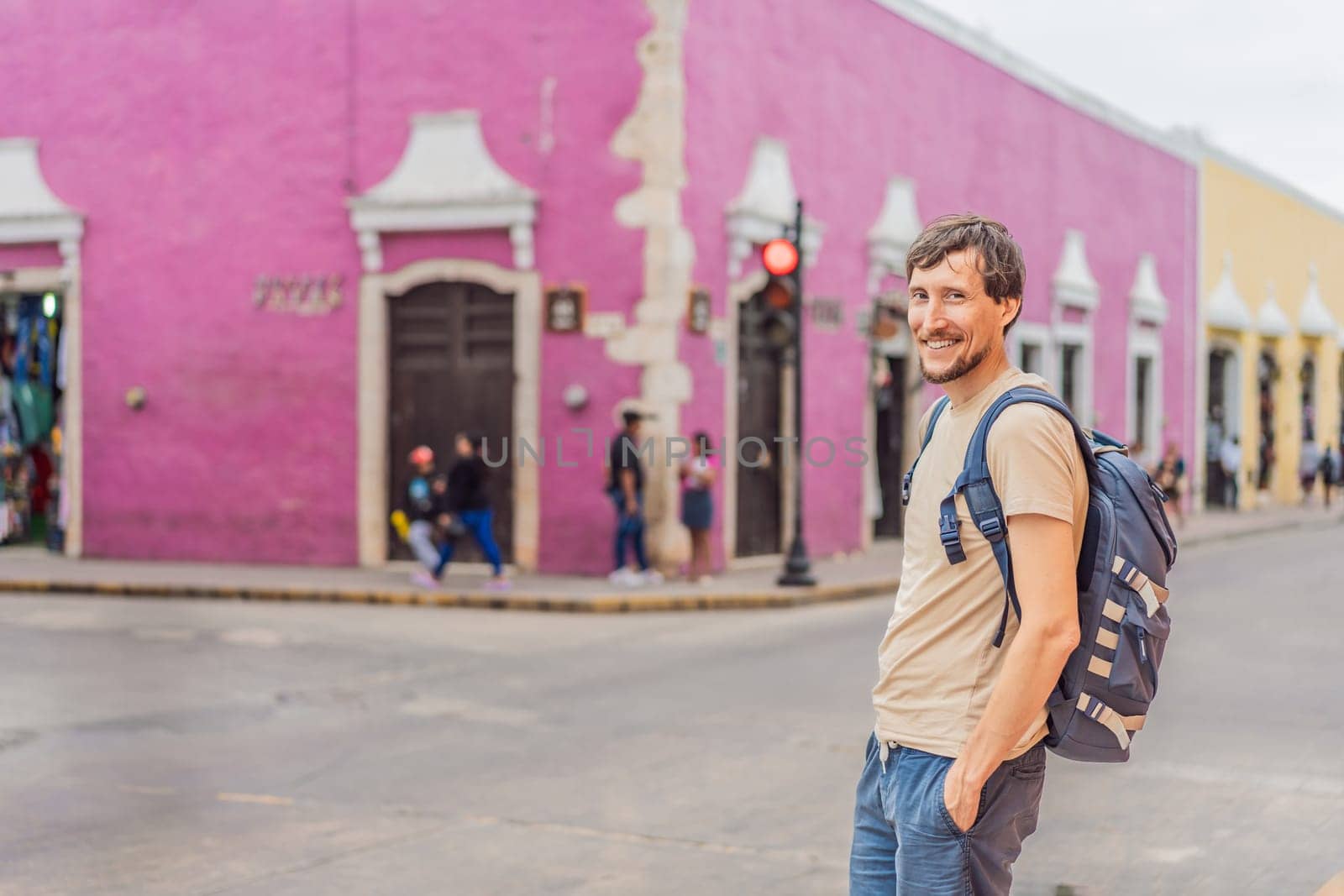 Man tourist explores the vibrant streets of Valladolid, Mexico, immersing herself in the rich culture and colorful architecture of this charming colonial town.