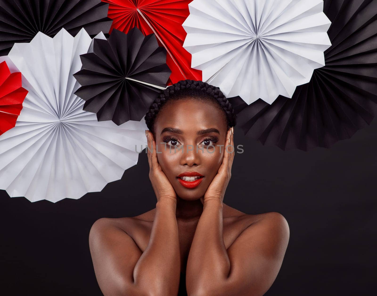 Female person, portrait and origami on hair in studio background for fashion with makeup, art and decor. African woman, artist and glamour for creativity, beauty or design with pride or confidence.