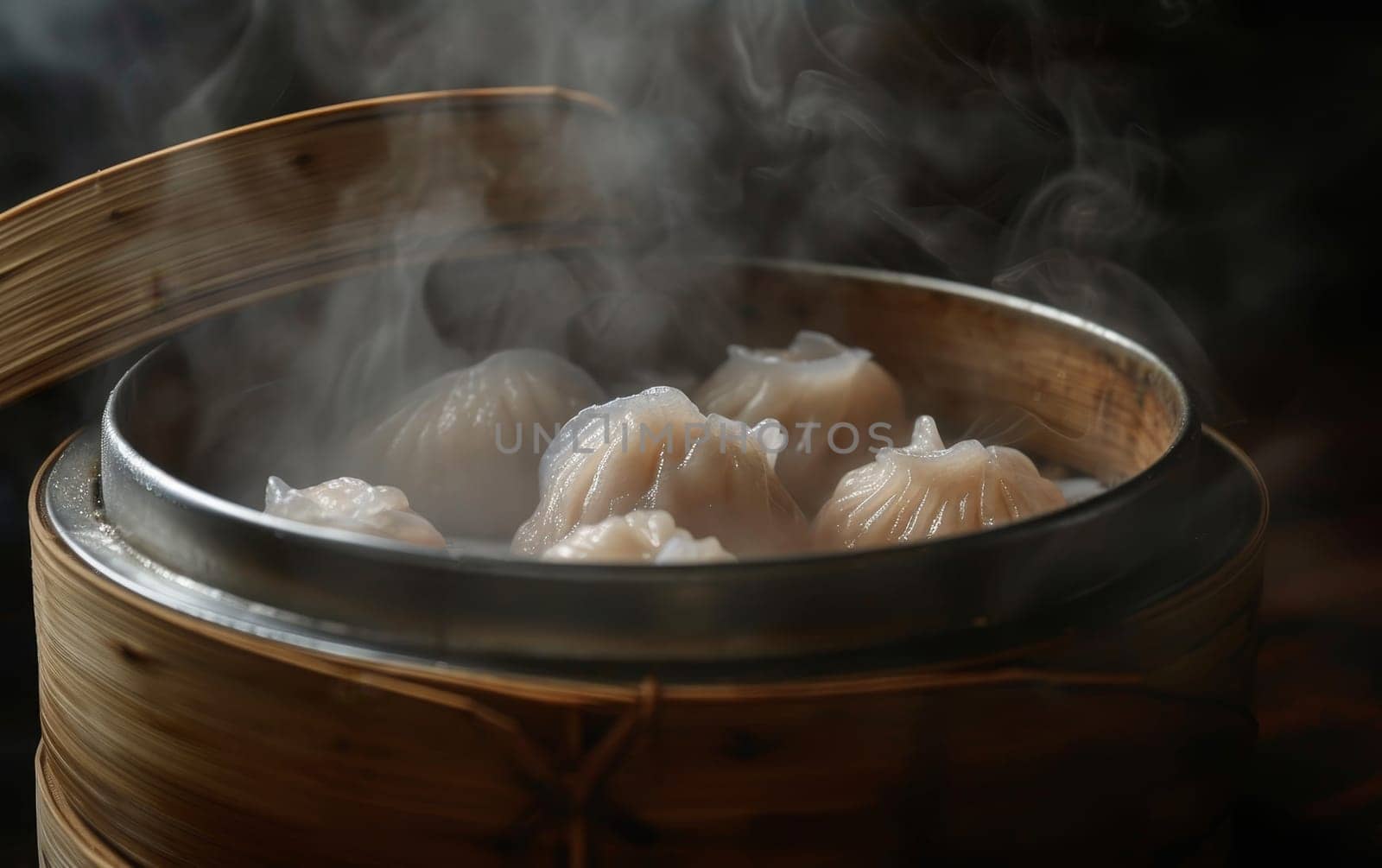 Close-up of steaming hot dim sum in a bamboo steamer, showcasing traditional Chinese cuisine