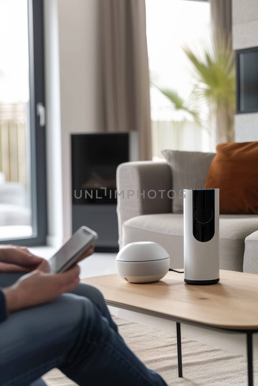 Comfortable living room featuring smart home technology with a user controlling devices via smartphone