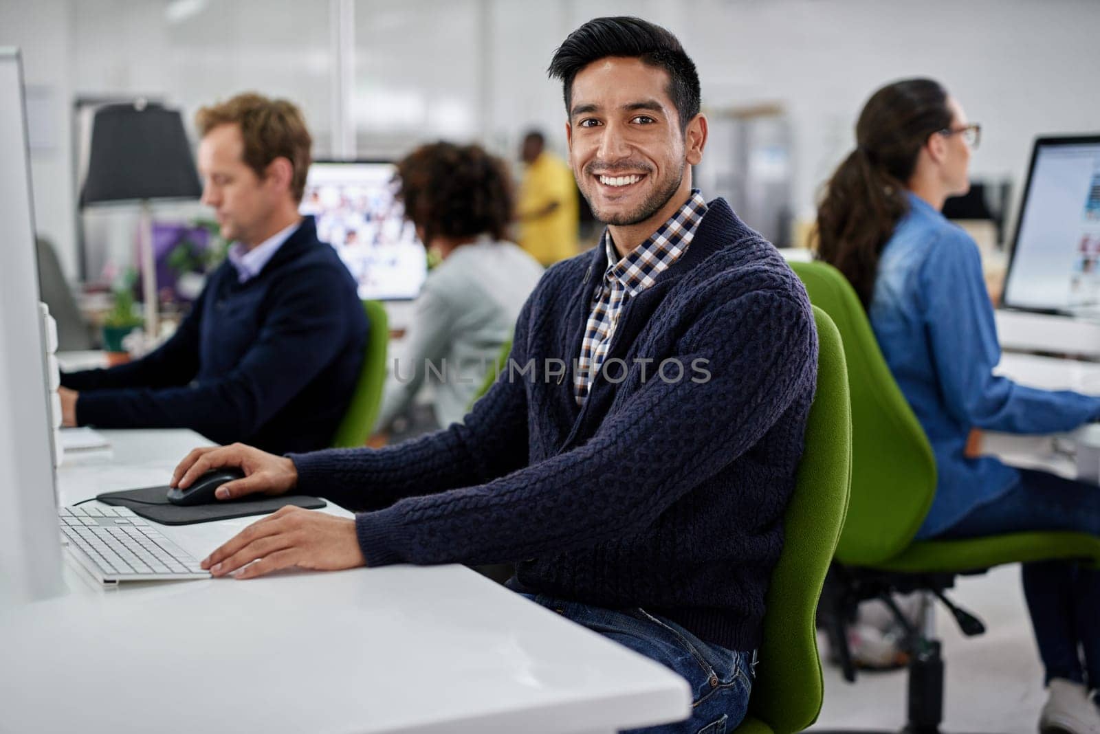 Man, portrait and computer in office for proposal, employee and business report or online. Male person, internet and coworking space for research, smile and proud of marketing agency and planning.
