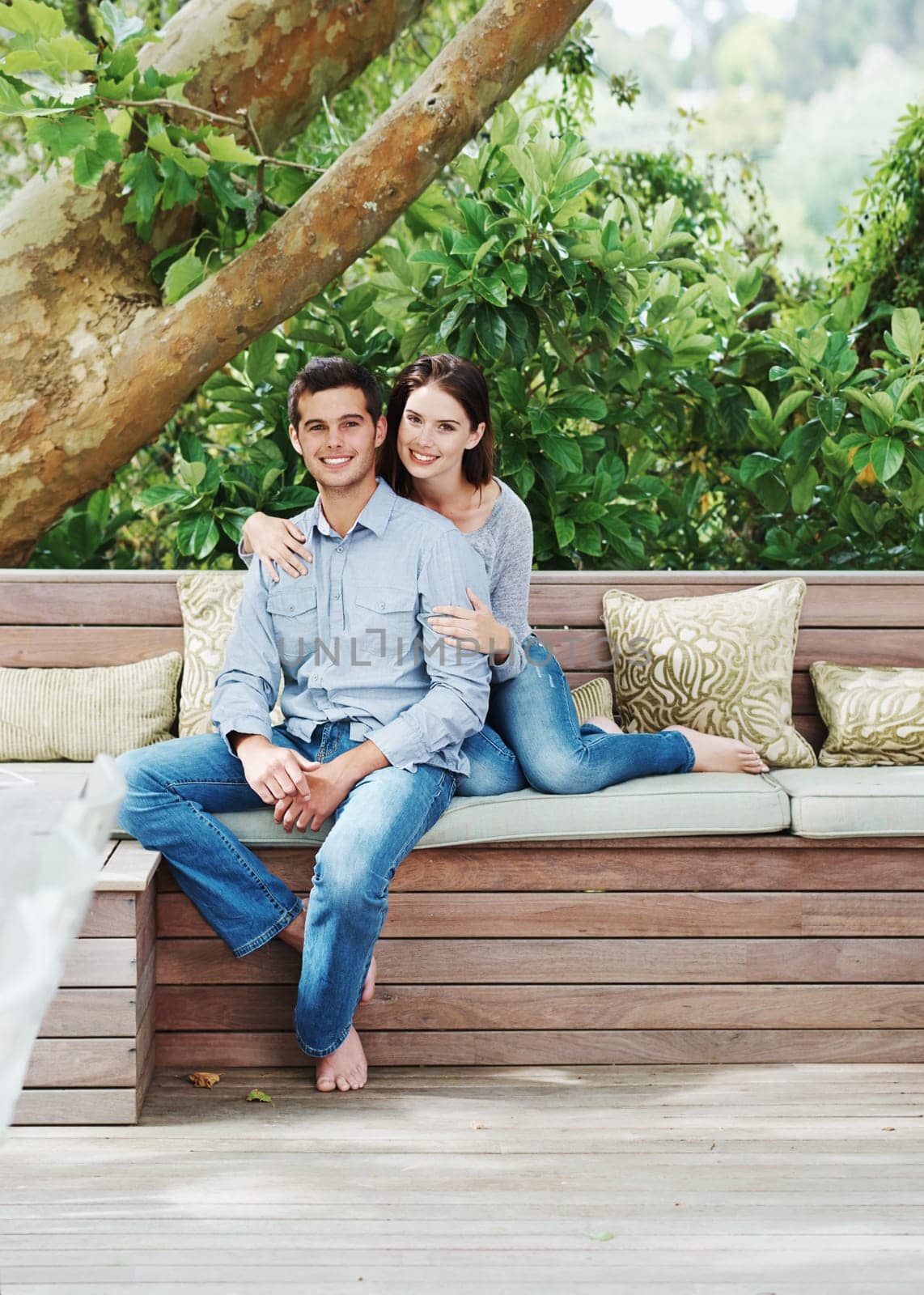 Couple, portrait and love outdoor on bench for relationship bond, wood floor and relax in nature. Woman, man and happiness together with trees for summer time, smile and romantic date in natural park.