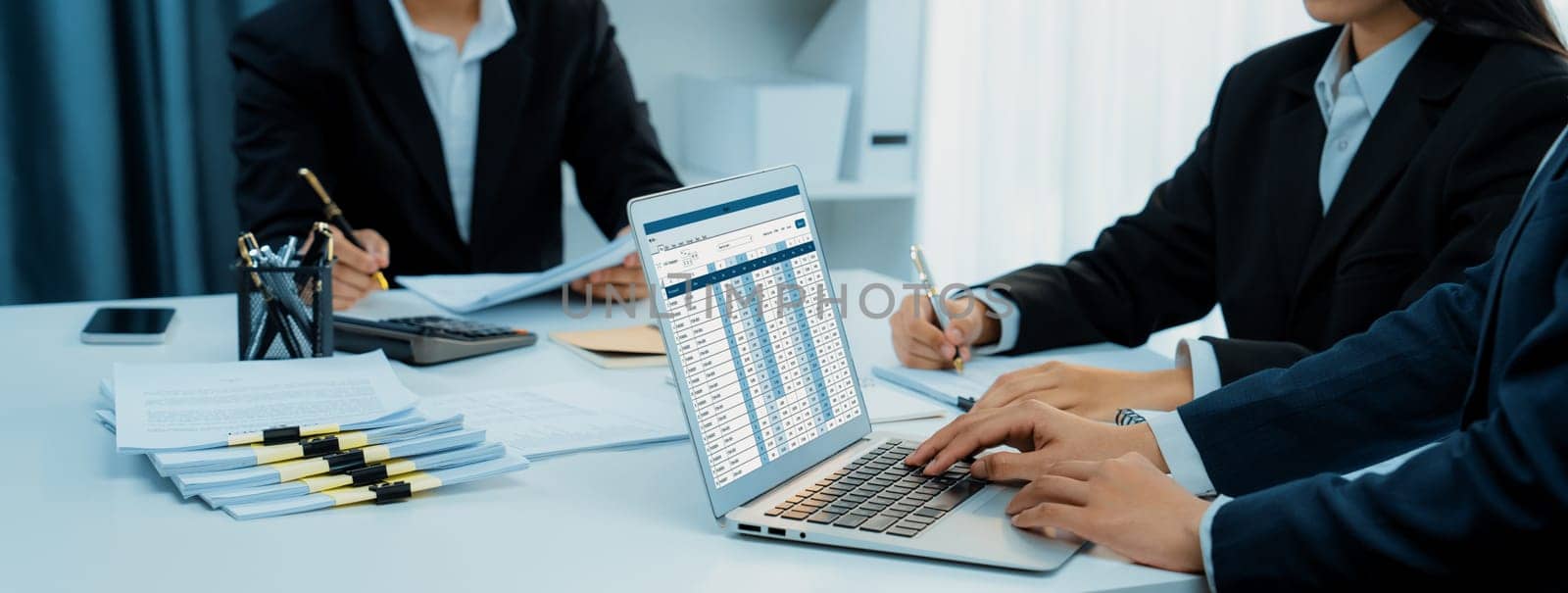 Corporate accountant use accounting software on laptop. Shrewd by biancoblue