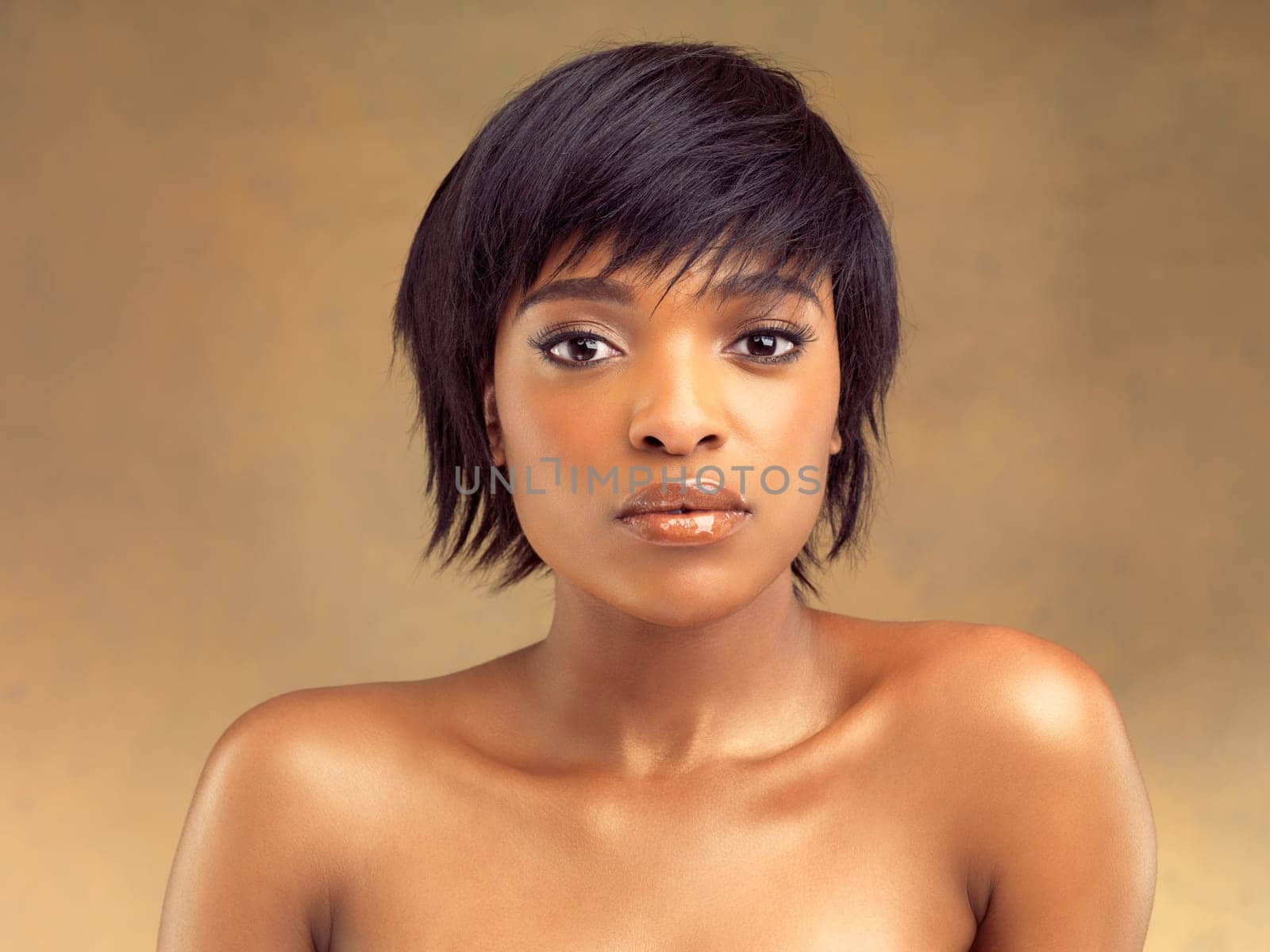 Dermatology, makeup and portrait of black woman for beauty, skincare or cosmetics isolated on brown background. Glow, face or African girl for self care, aesthetic or natural shine on studio backdrop.