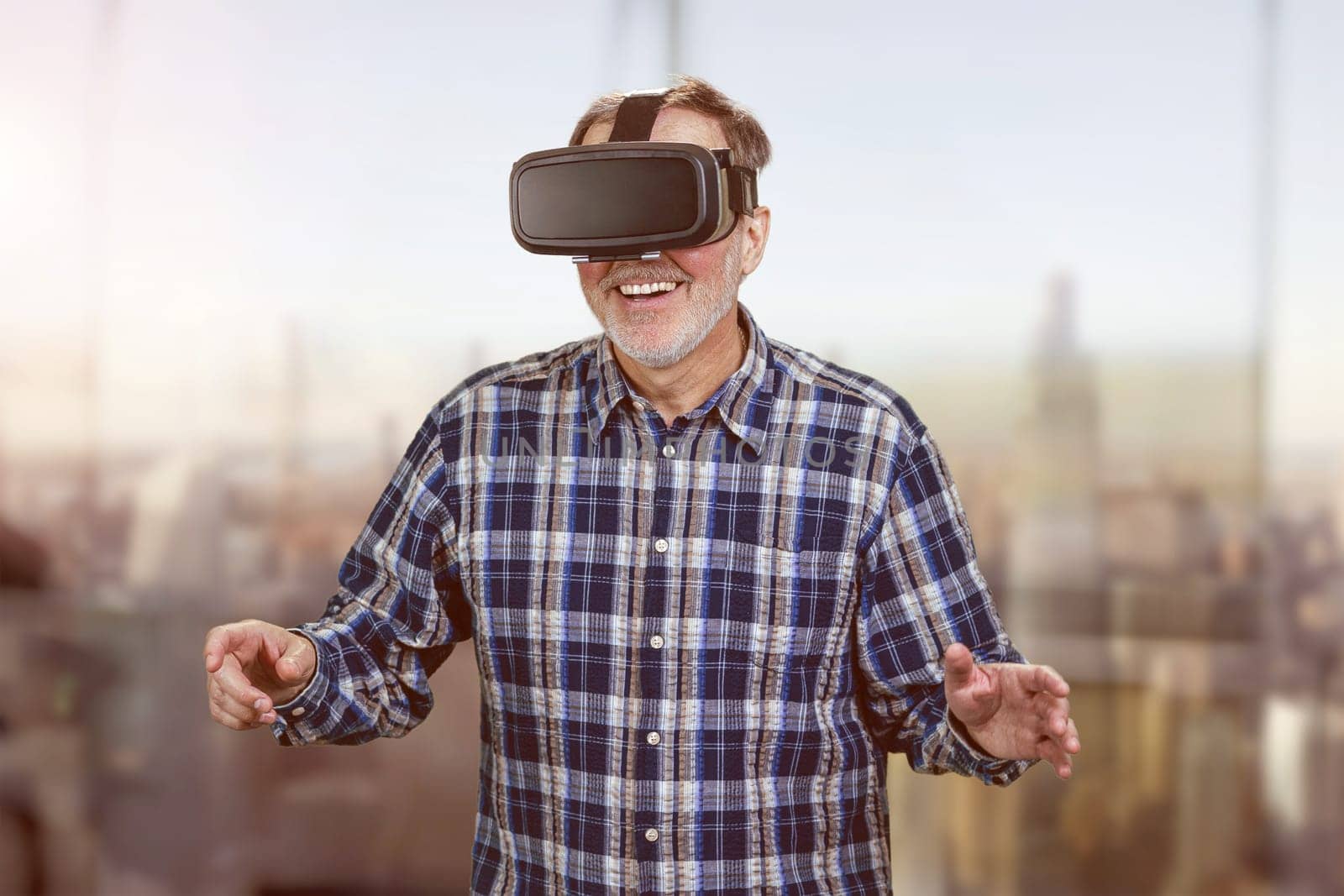 Happy smiling elder man in vr headset. by super_picture