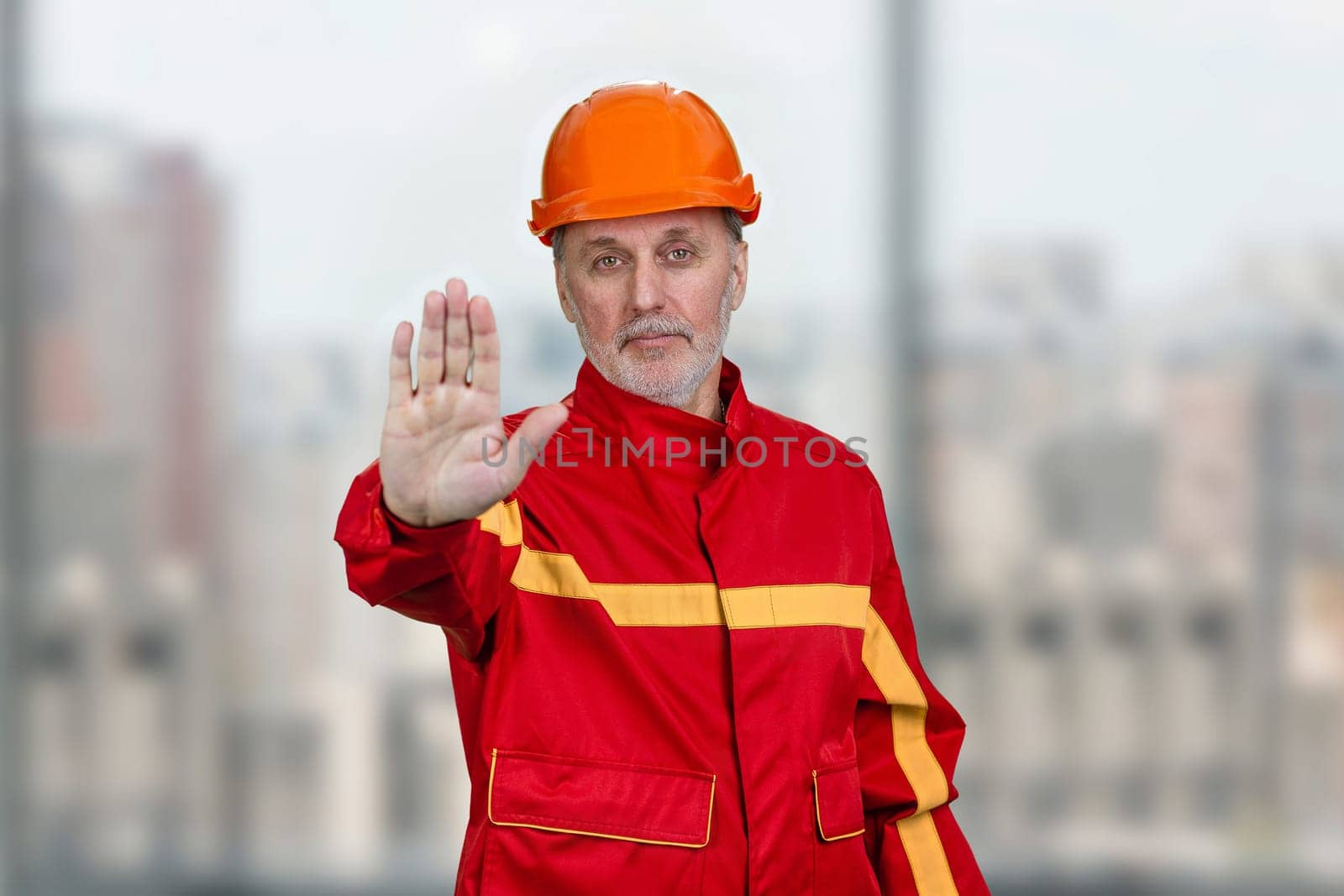 Mature construction worker handyman shows the no reject gesture sign. by super_picture