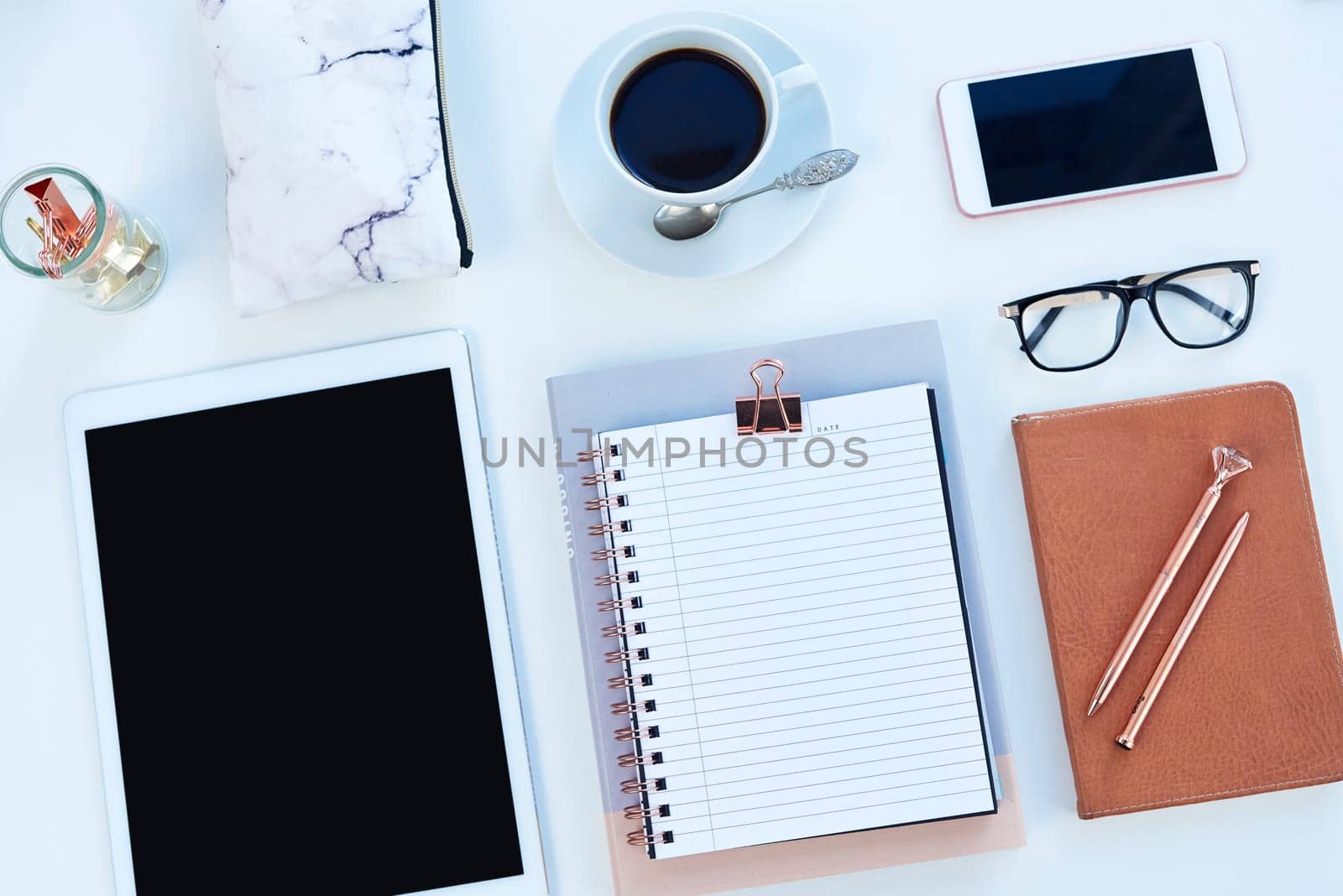 Tablet, smartphone and notebook or above, student workspace and mockup for online elearning station. Blog, pen and technology aesthetic for social media, website and internet display with coffee.