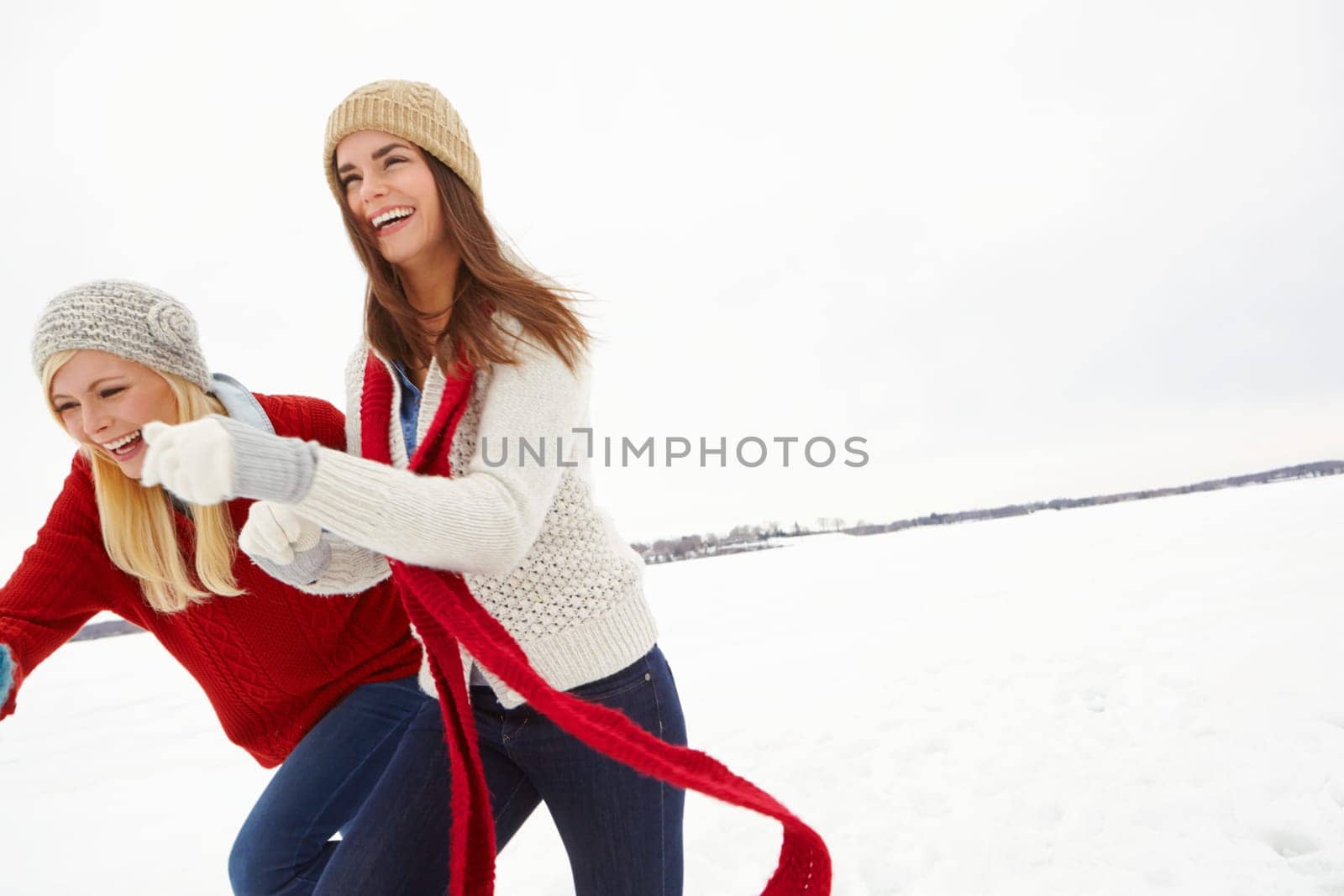 Winter, love and lesbian couple outdoor in snow on romantic vacation, adventure or holiday. Happy, laugh and lgbtq women in relationship for fun and bonding in cold weather on weekend trip in Iceland.