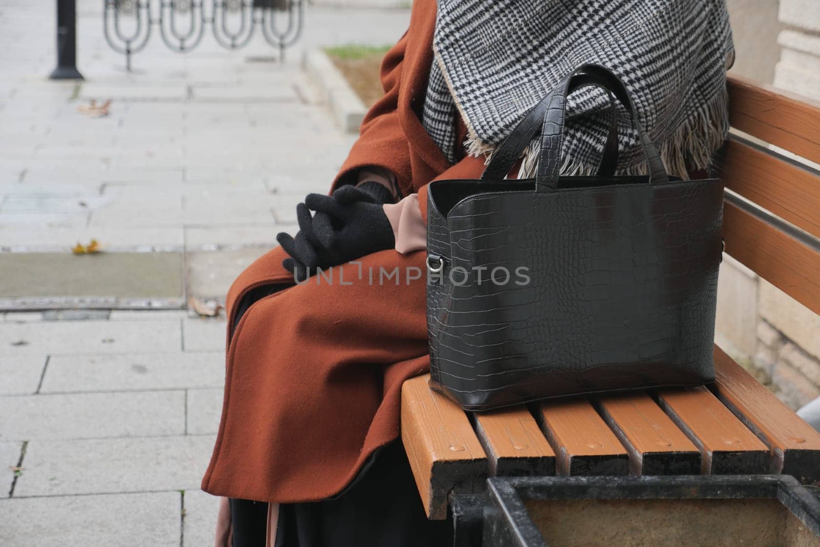 Woman left her purse on a bench in a park. by towfiq007
