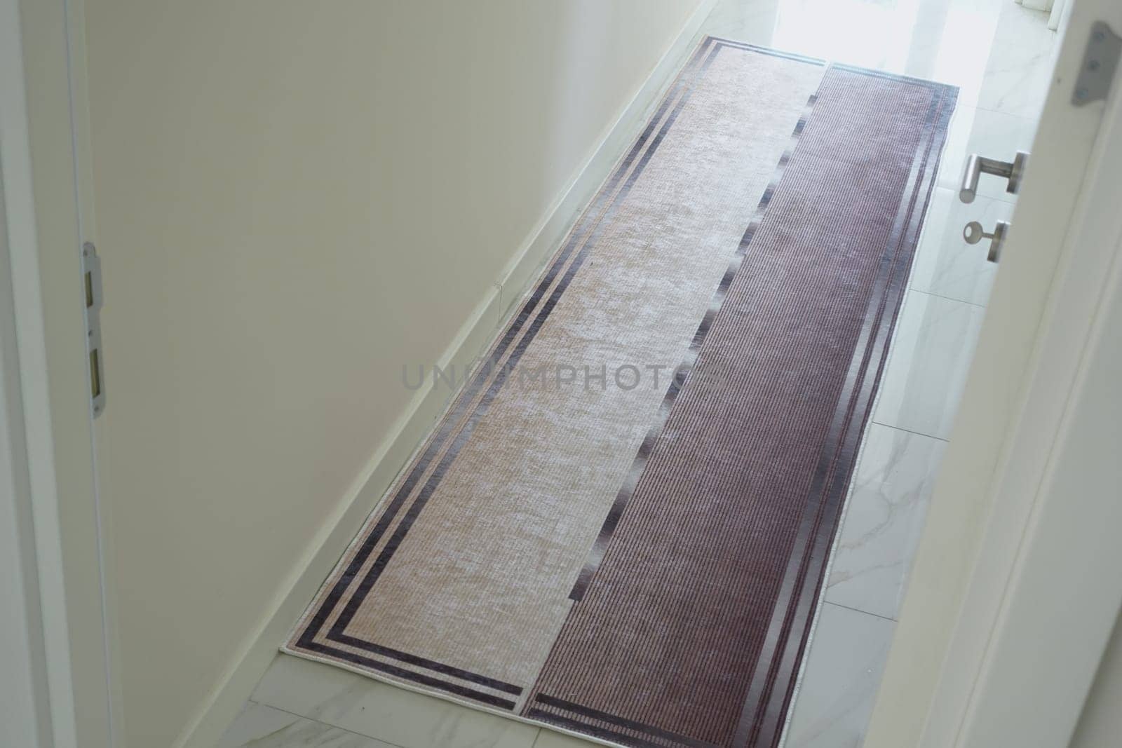 long carpet texture background on tiles floor .