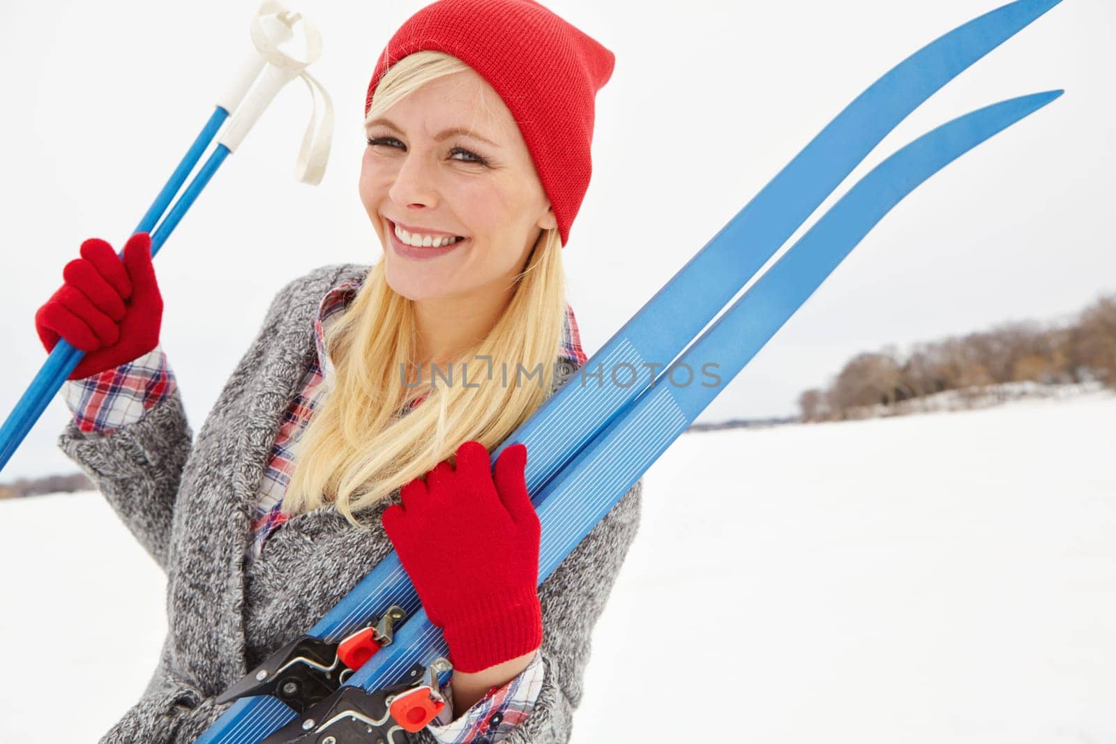 Woman, portrait and happy on vacation with ski equipment for alpine adventure, fun and exploring snowy wilderness. Girl, smile and outdoor on winter holiday in Alaska for getaway and travel tour