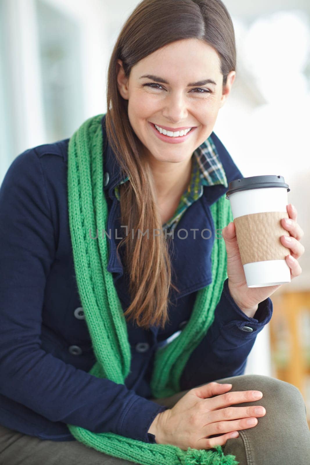 Woman, portrait and happy with coffee in home for morning routine in winter to warm up and relax for cozy ambiance. Girl, caffeine beverage and indoor bliss in house for contentment and chilling