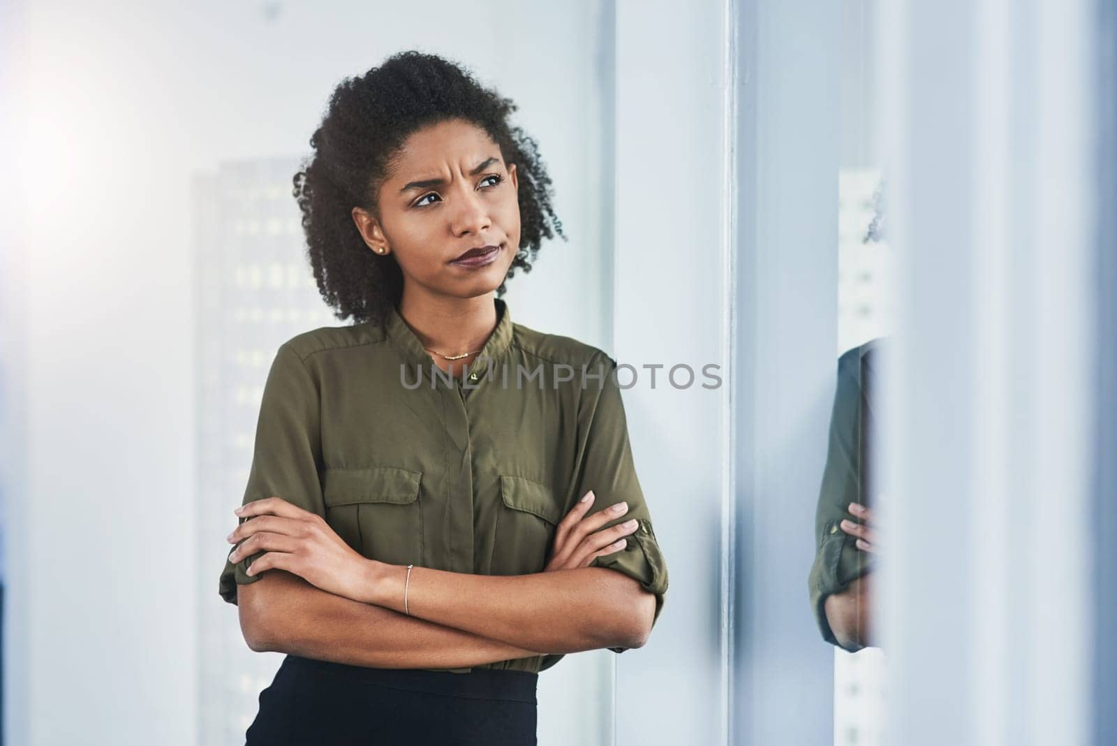 Window, thinking and confused woman with arms crossed in office for idea, memory or planning solution. Remember, reflection or female African manager with problem solving focus, doubt or questions by YuriArcurs