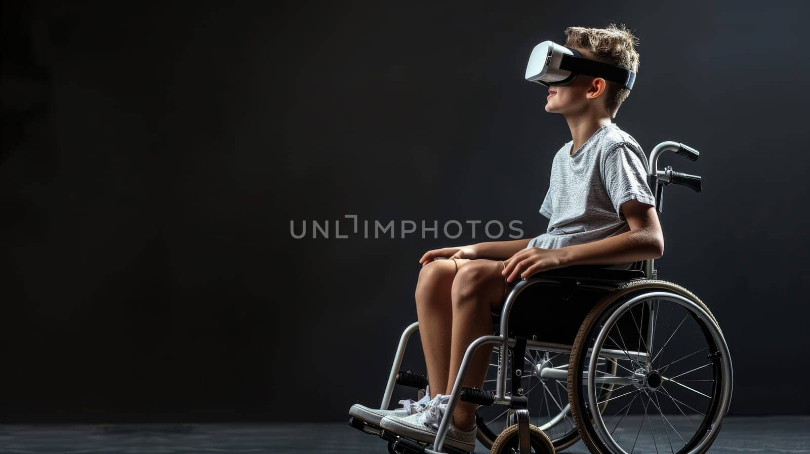 A disabled boy in wheelchair wearing VR glasses on dark background.