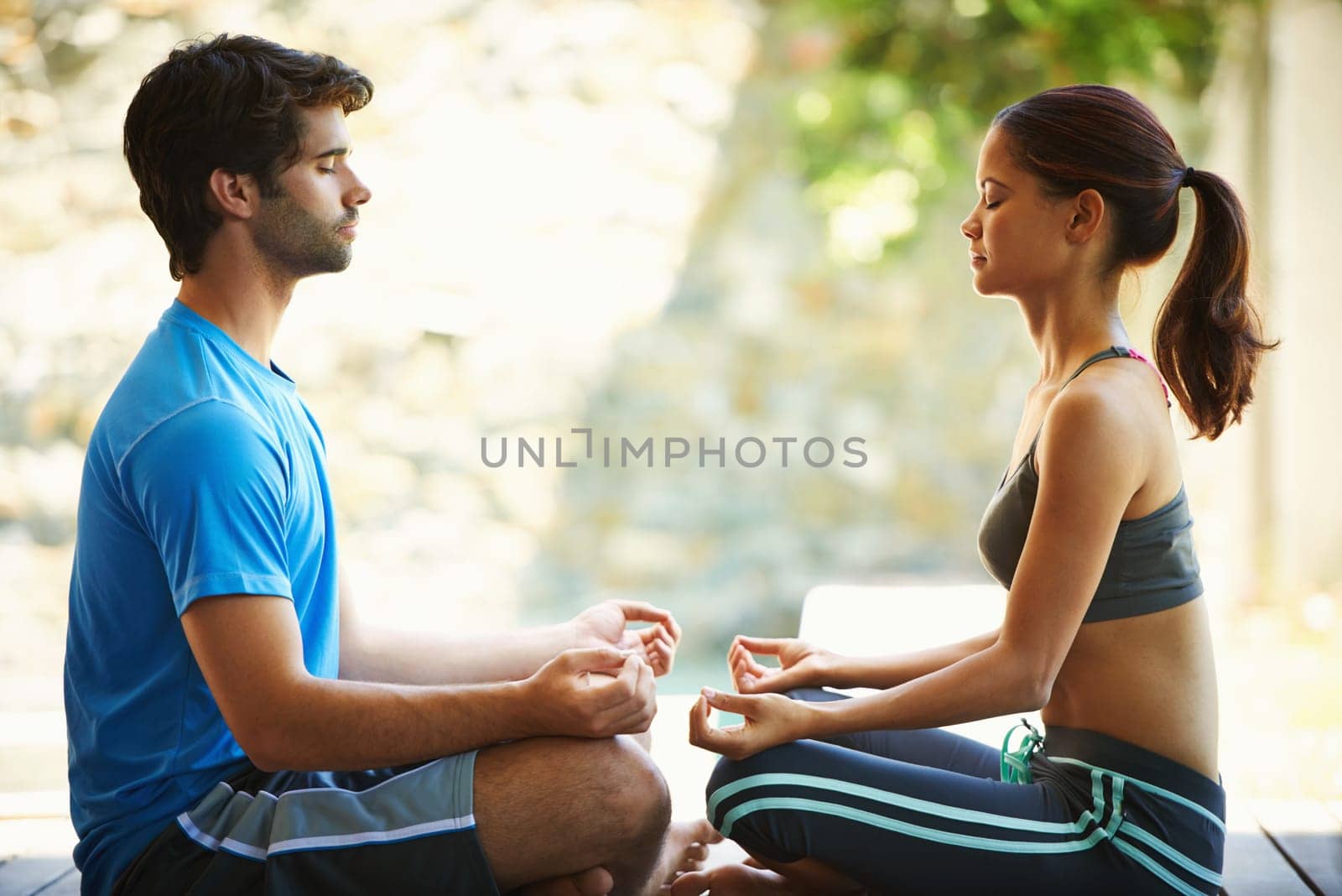 Man, woman and yoga class for meditation, fitness and wellness for health and workout. People, sitting and zen for peace, lotus pose and balance with instructor for holistic energy with home pilates.