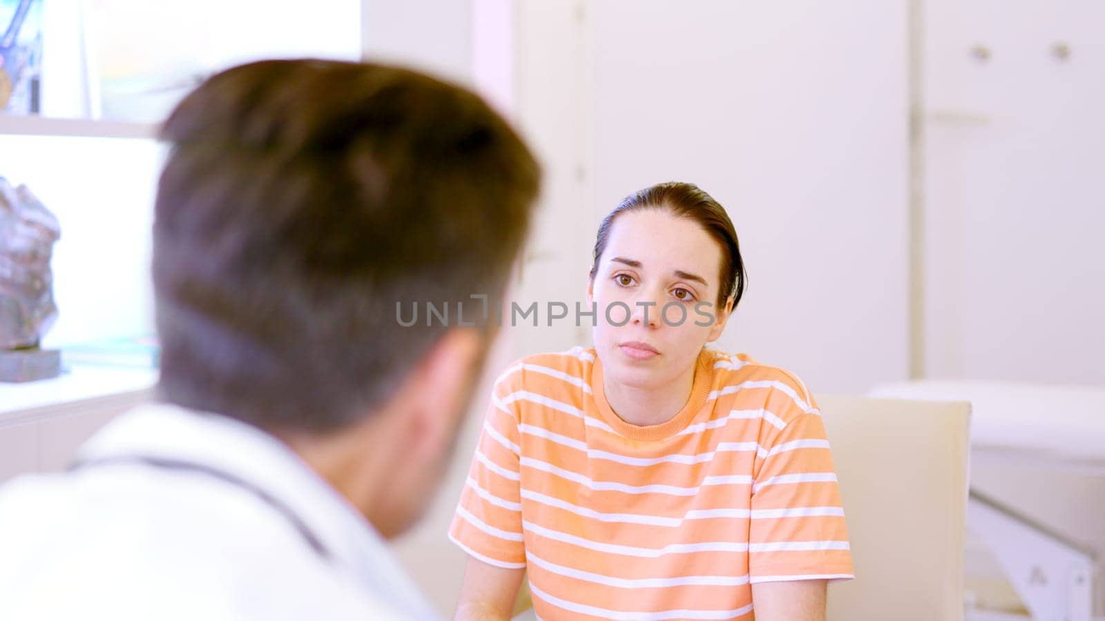 Female patient listening attentively to the doctor in a consultation
