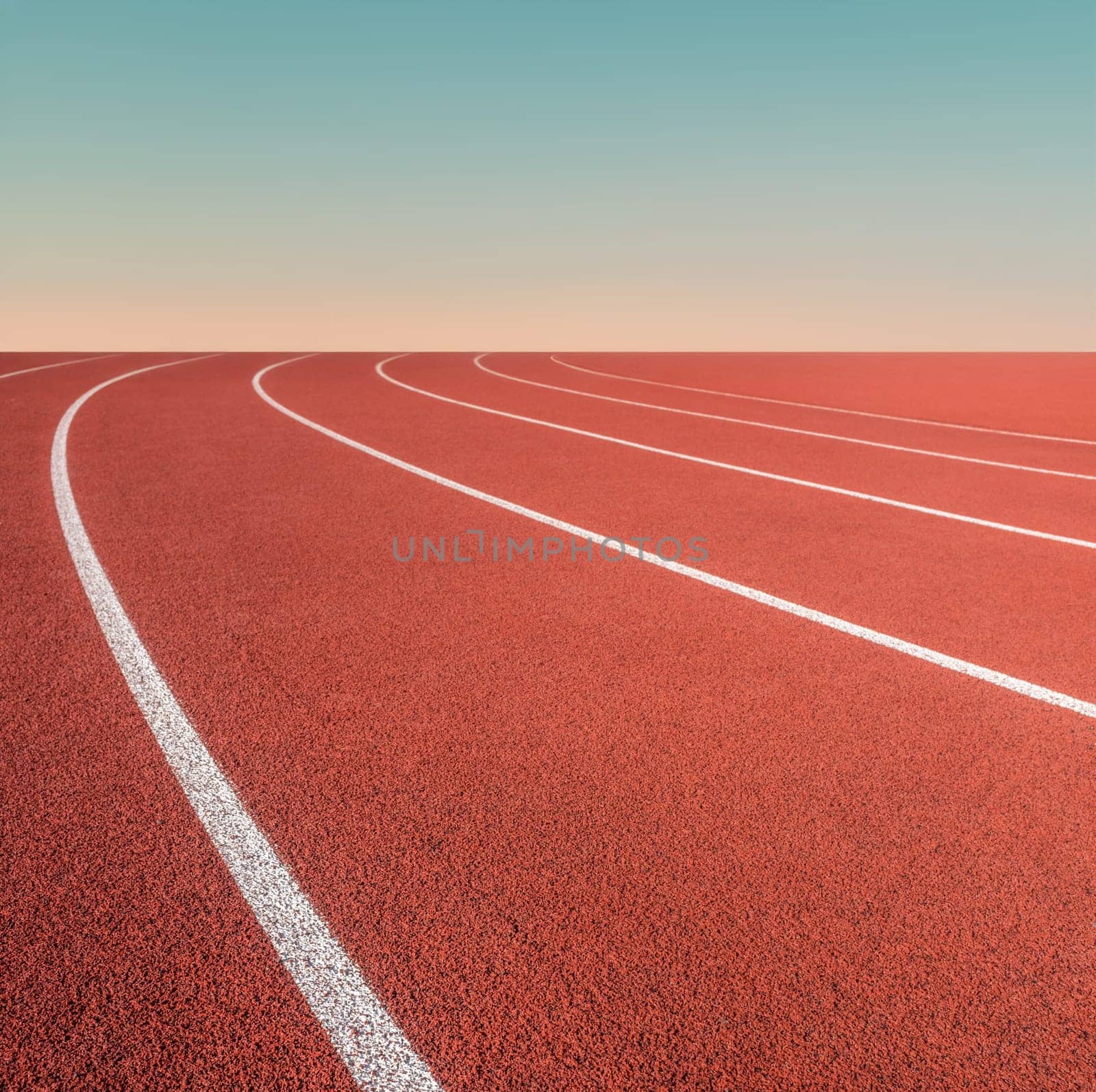 Conceptual Image Of Sports Ground Running Race White Markings And A Distant Sunset