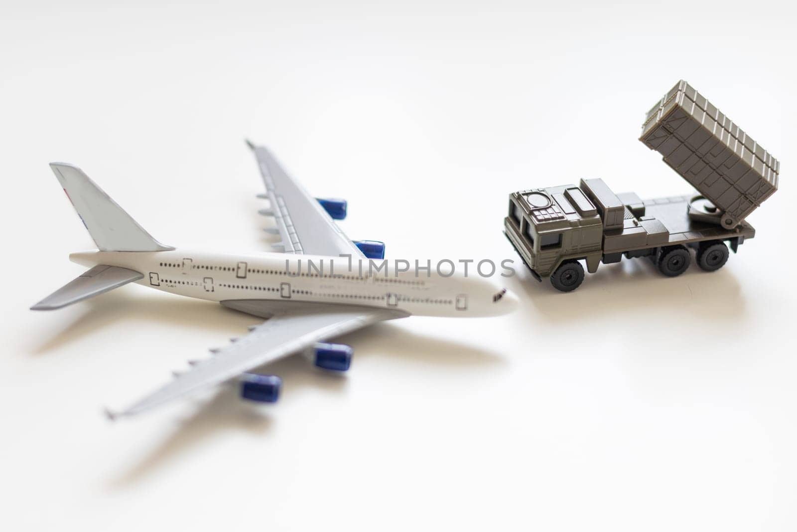 Top view on plastic model military vehicle and aircraft. High quality photo