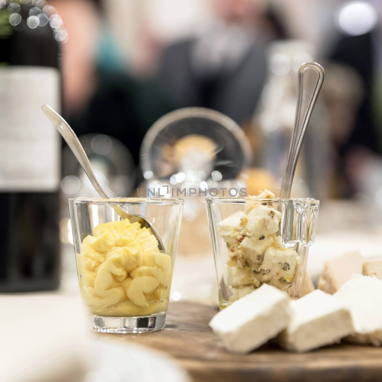 Wooden plate with cheese antipasti by germanopoli