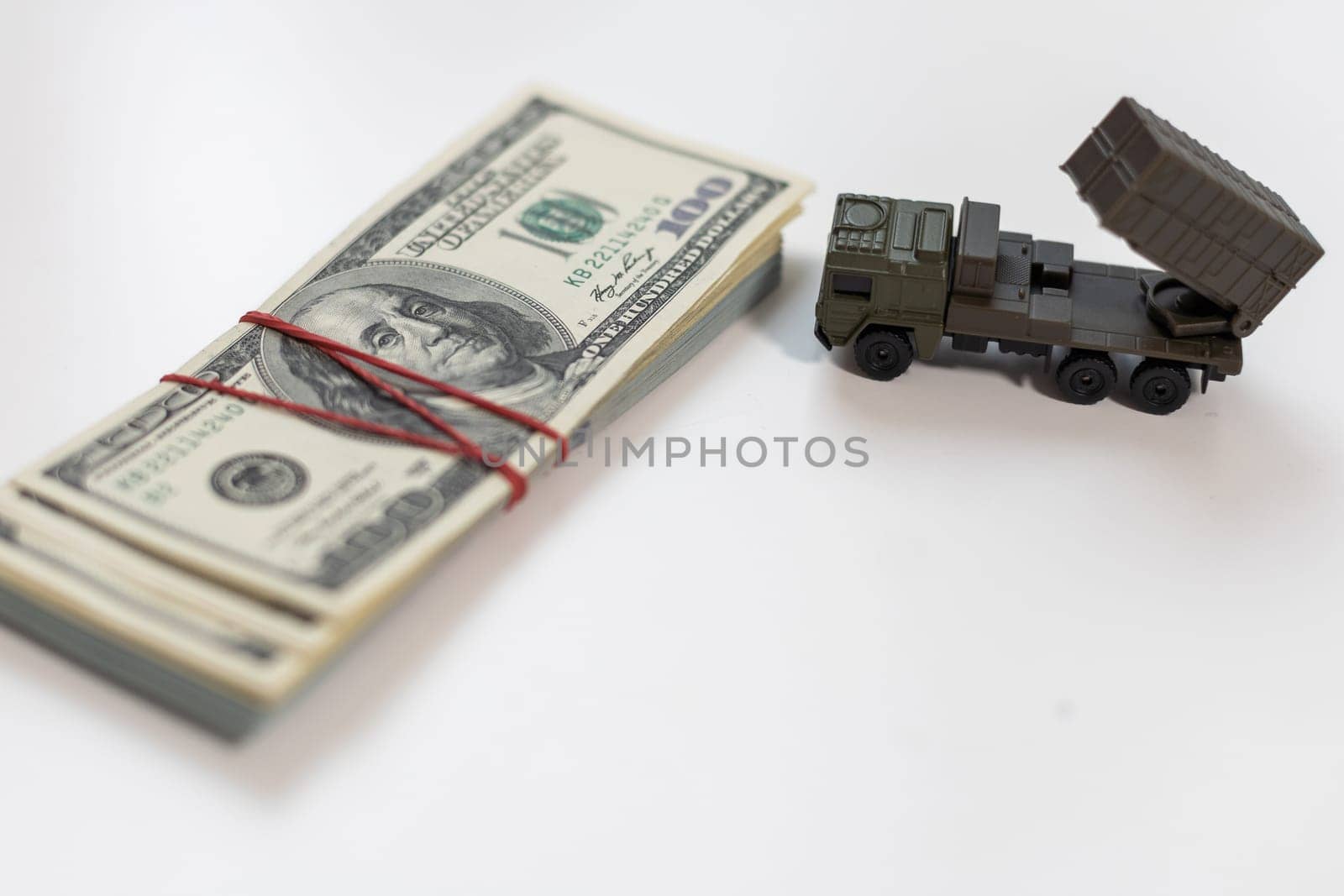 concept four rockets sent upwards against a hundred dollar banknote money background. Weapons of mass destruction, nuclear warhead, chemical charge. armament. High quality photo