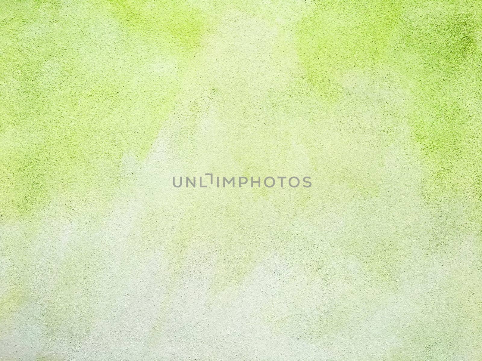Concrete lime green colorful wall surface texture. Abstract grunge bright illuminating color background. Copyspace.
