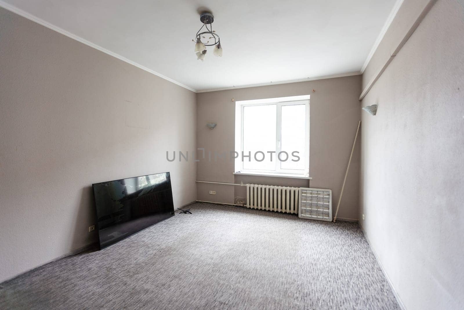 Empty room with all white walls and parquet floor. Nobody inside the room. High quality photo