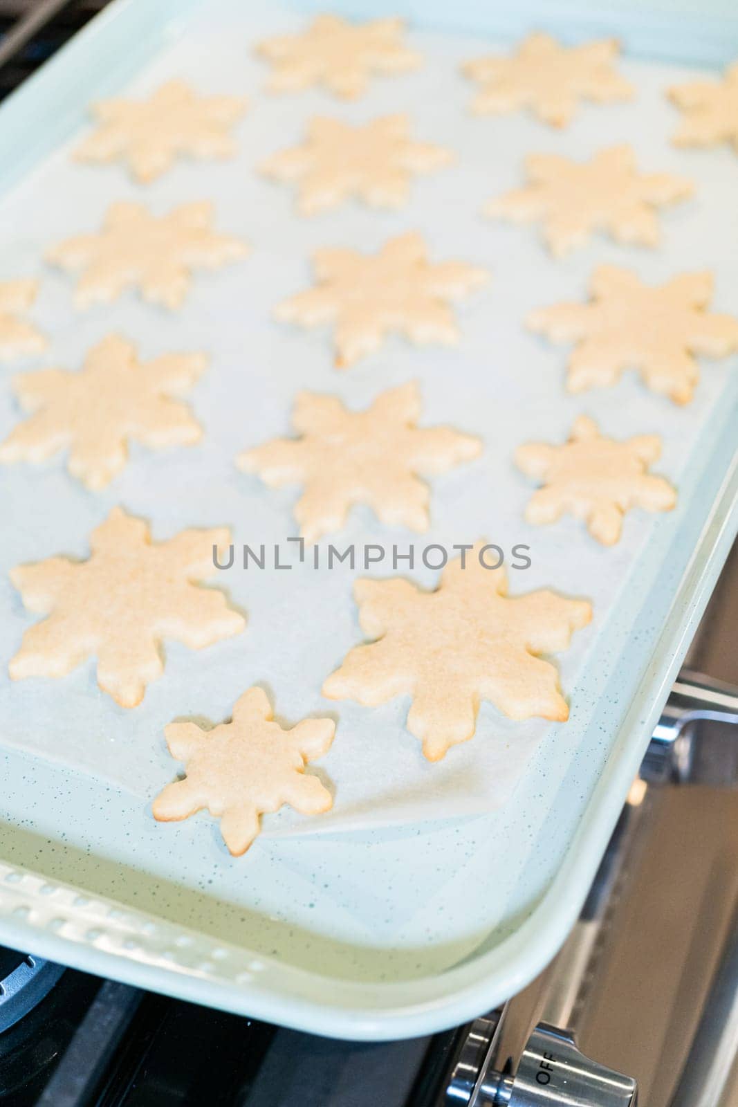 Baking Snowflake-Shaped Sugar Cookies for Homemade Christmas Gifts by arinahabich