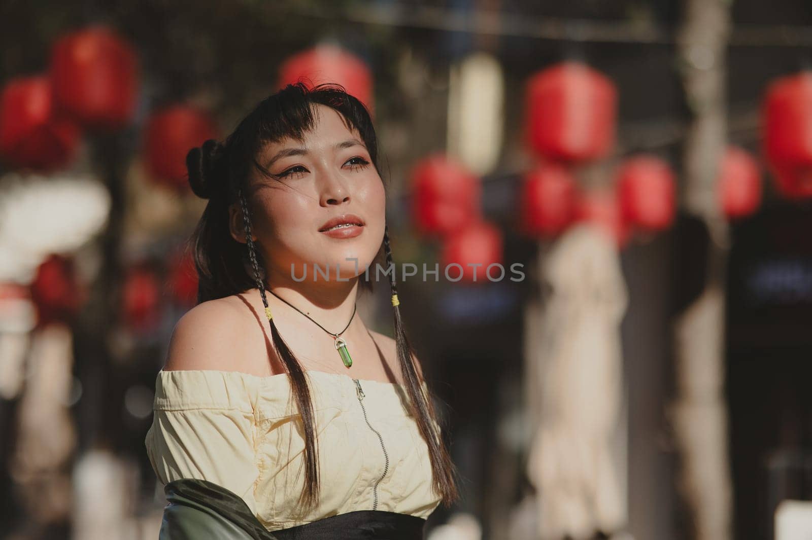 Portrait of an Asian woman against the background of Chinese lanterns. by mrwed54