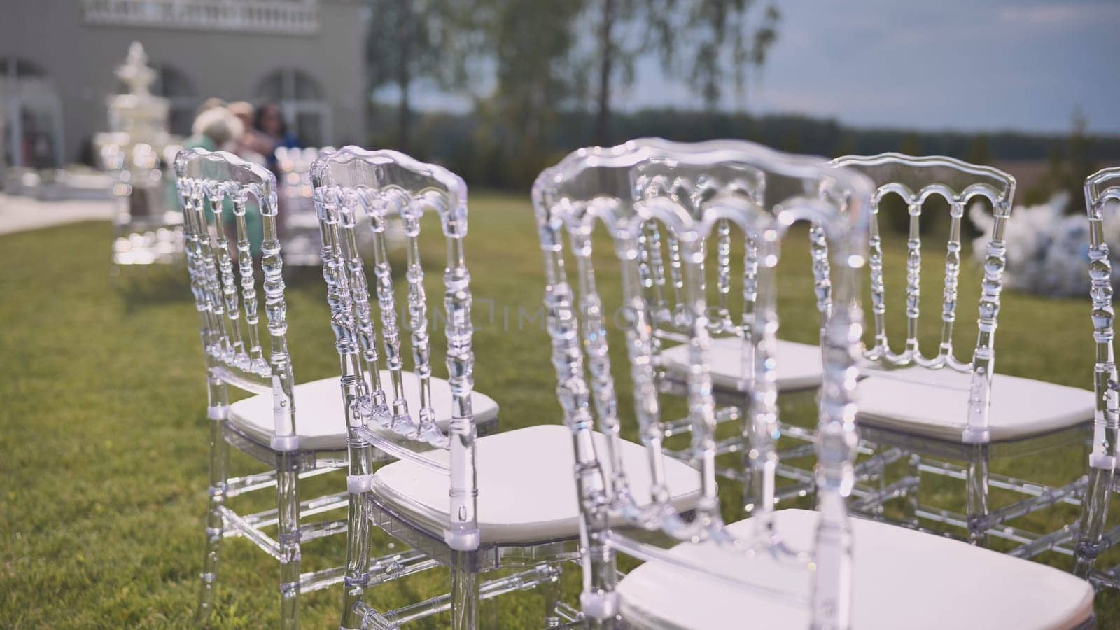 Chairs at the offsite wedding ceremony. by DovidPro