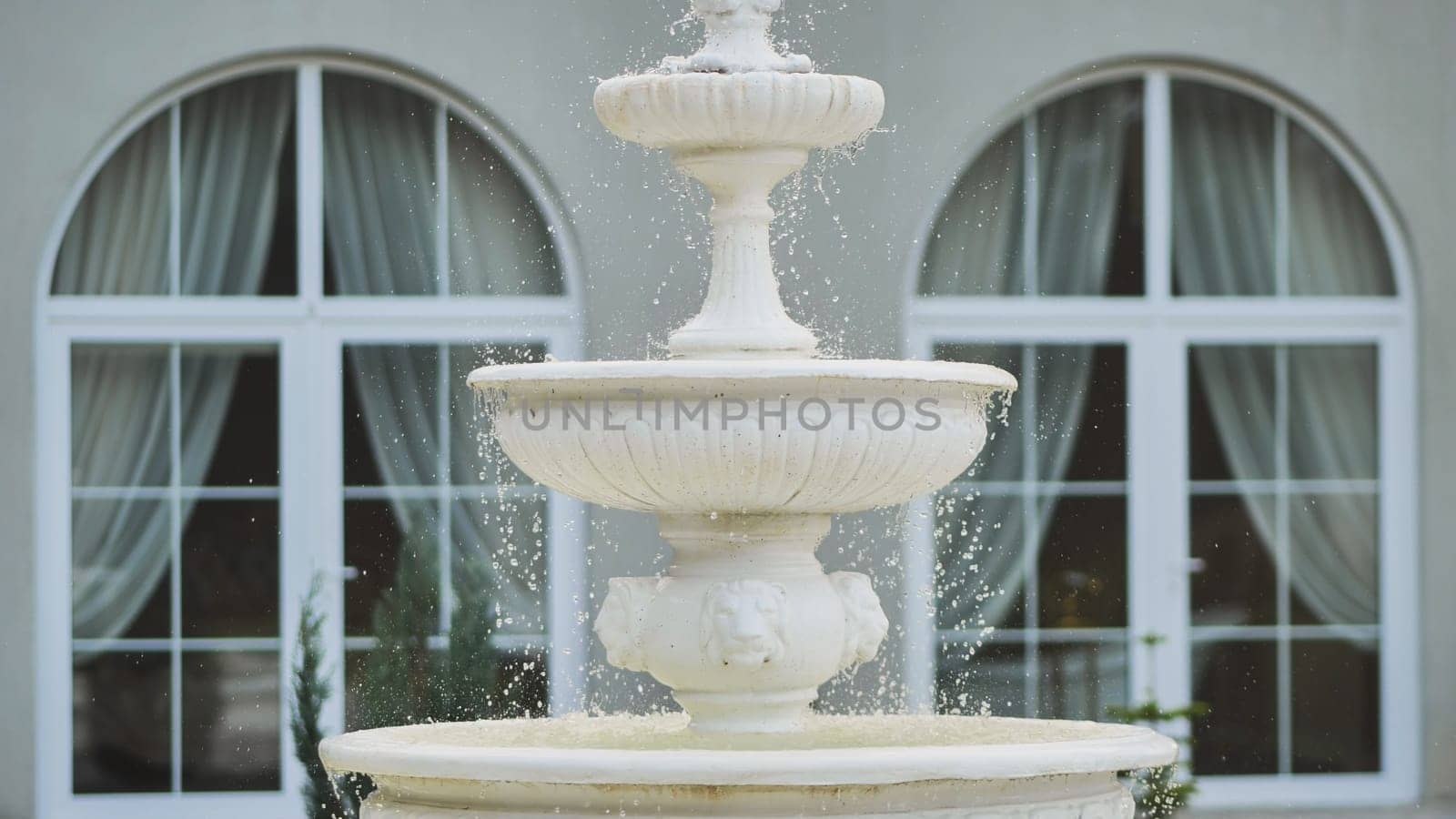 White architectural fountain on the estate. by DovidPro