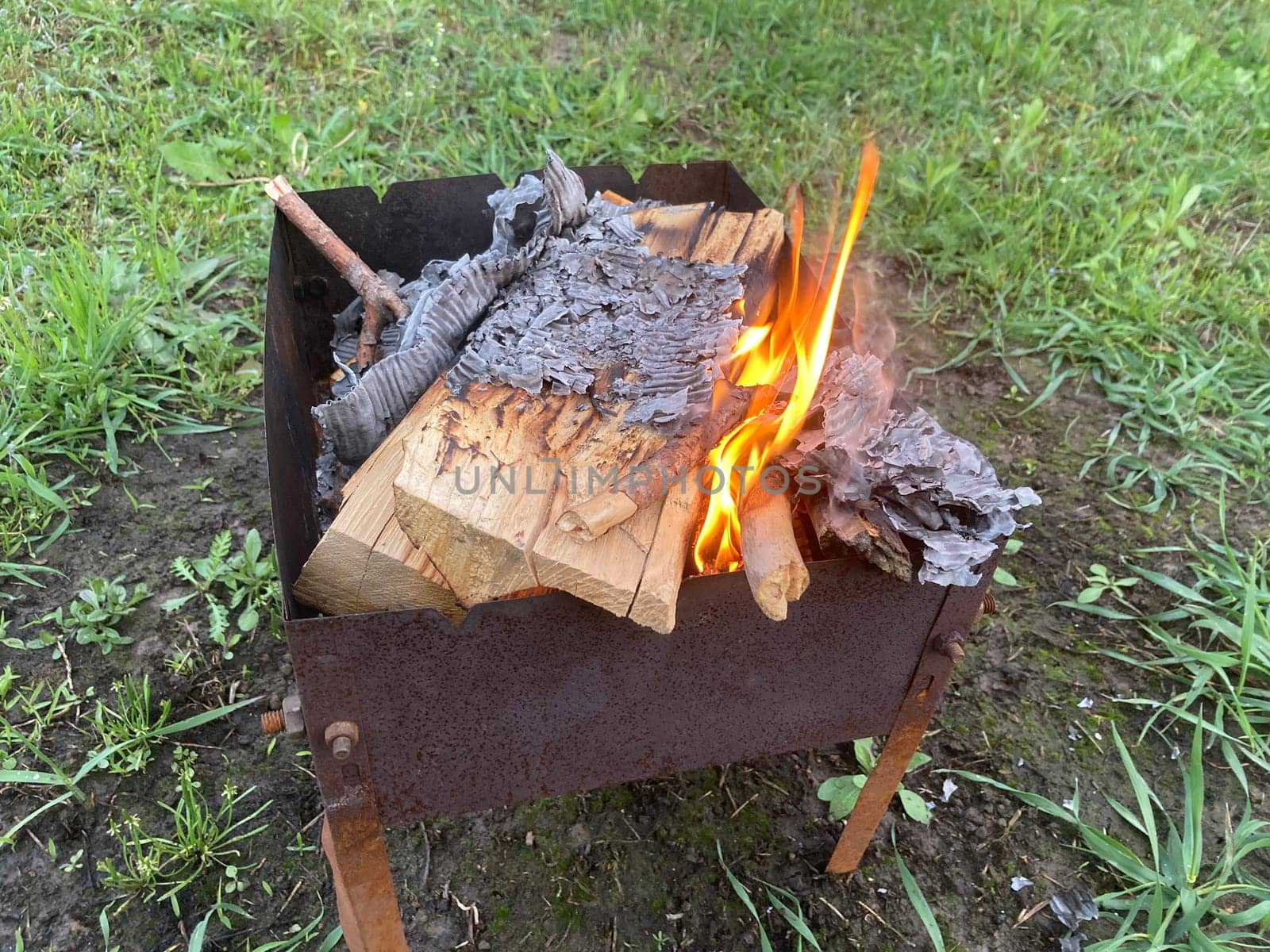 The barbecue grill is lit for the cooking outdoors