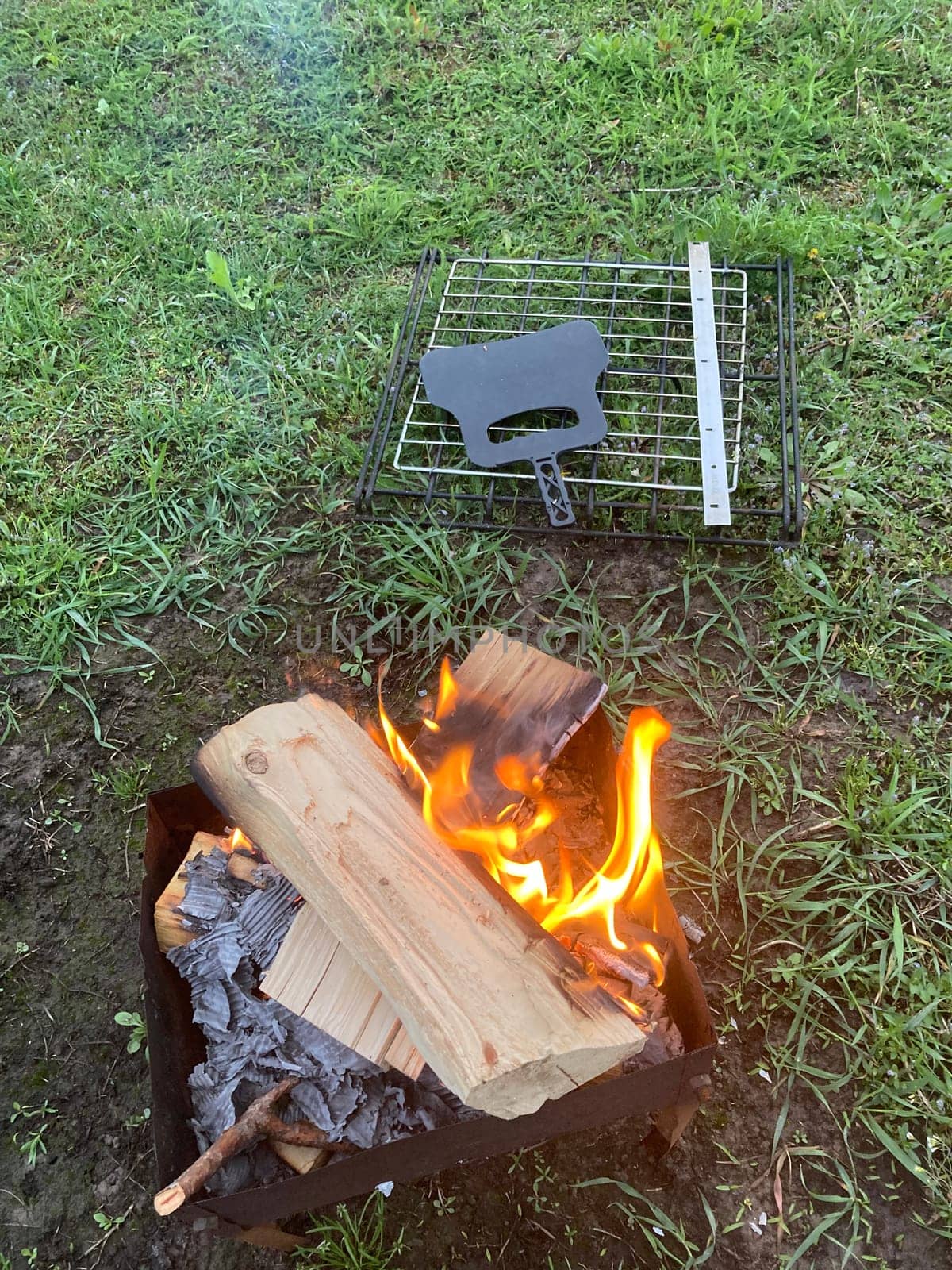 The barbecue grill is lit for the cooking outdoors