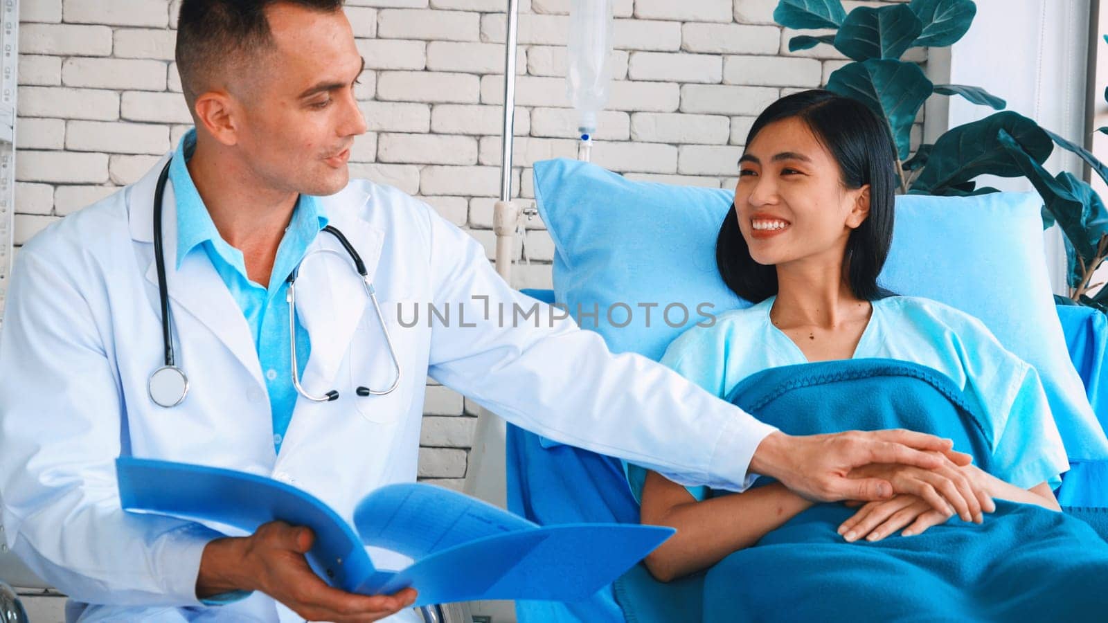 Doctor in professional uniform examining patient at hospital Jivy by biancoblue