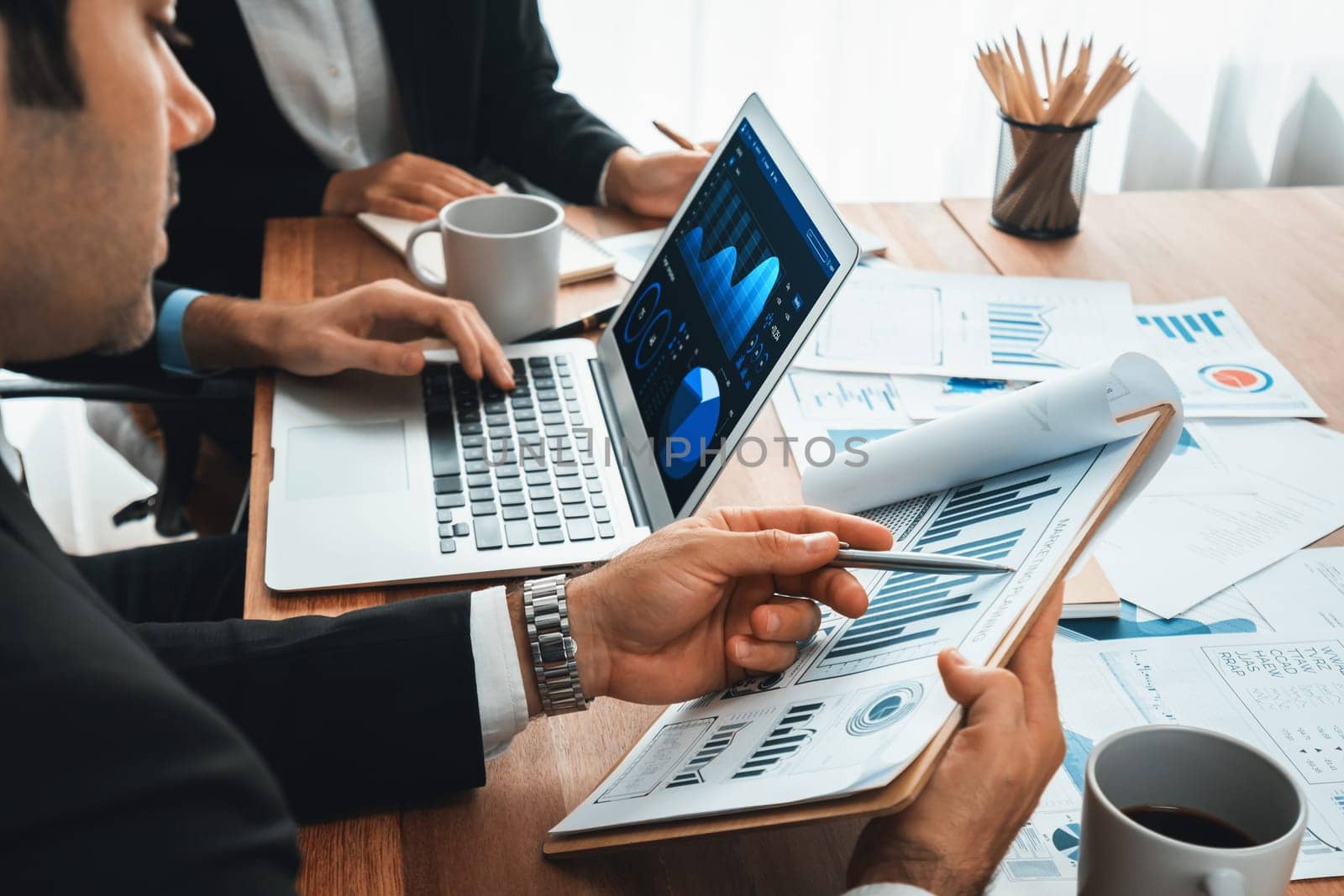 Financial data analysis dashboard by Fintech BI or business intelligence display on laptop and tablet to in-depth financial data analysis by business people planning on marketing. Habiliment