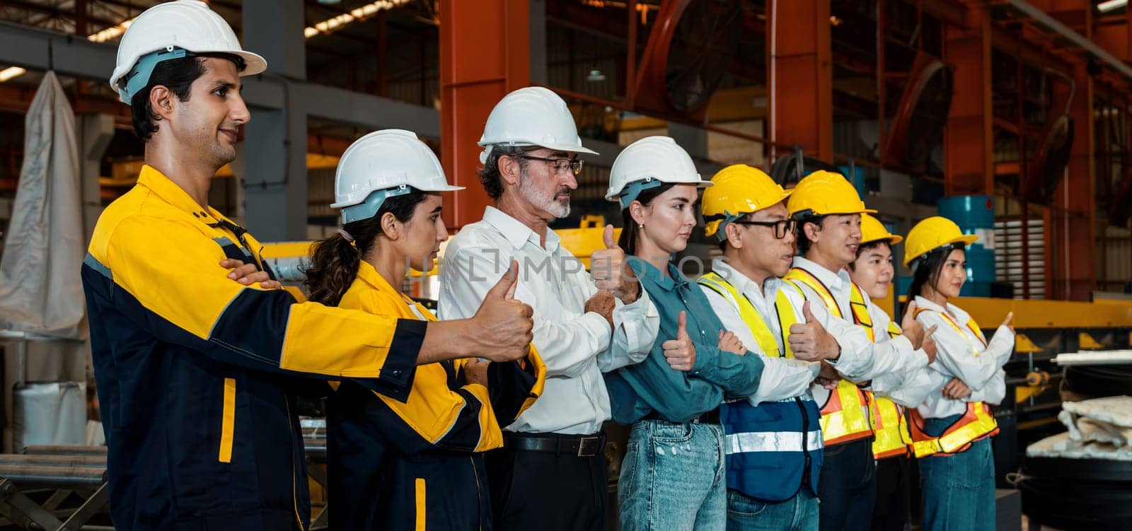 Confident and smiling lineup of factory worker, engineer. Pano Exemplifying by biancoblue