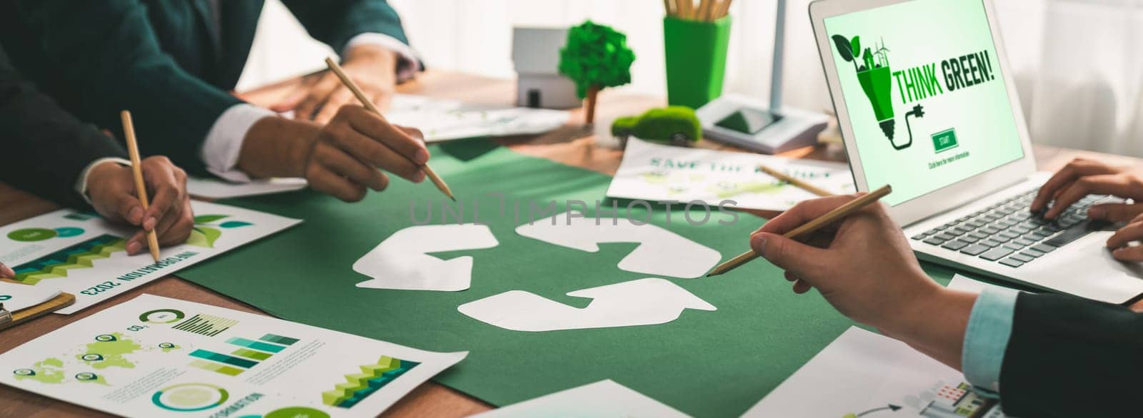 Group of business people planning and discussing on recycle reduce reuse policy symbol in office meeting room. Green business company with eco-friendly waste management regulation concept.Trailblazing