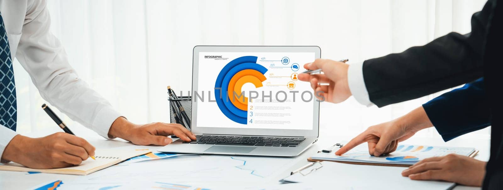 Business people in group meeting in formal attire share idea discussing report for company profit in creative workspace for start up business shot in close up view on group meeting table . Oratory .