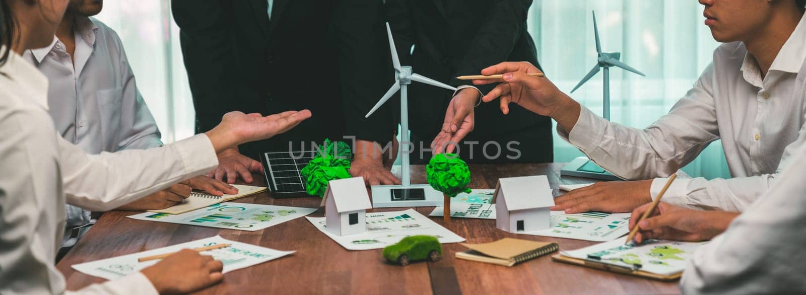 Eco business company meeting with group of business people planning strategy and discuss marketing of eco-friendly and renewable clean energy products. Green business company concept. Trailblazing