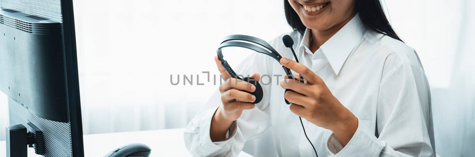 Business people wearing headset working in office to support remote customer or colleague. Call center, telemarketing, customer support agent provide service on telephone video conference oratory call